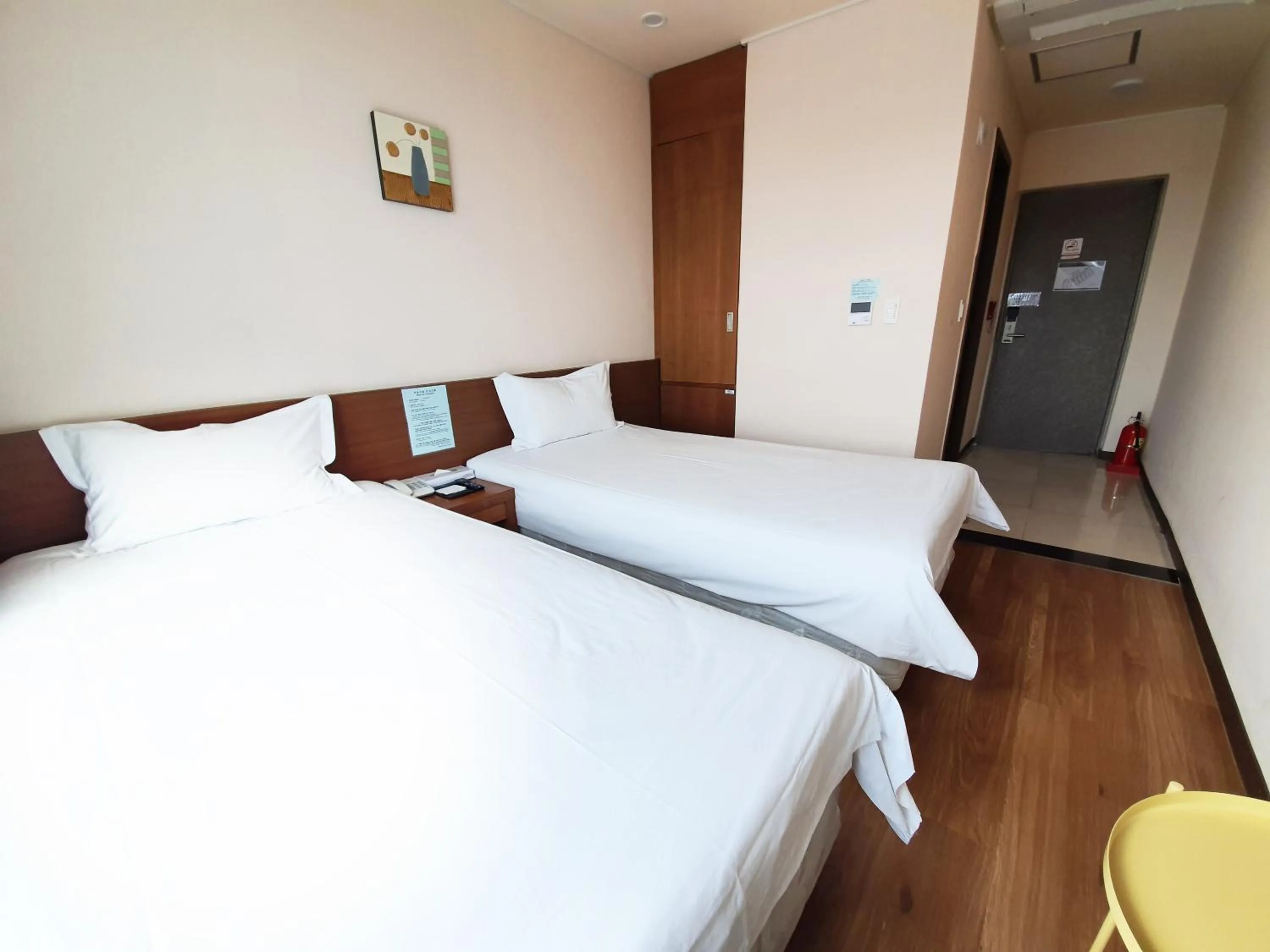 Bed in Jeju Jungmun Ocean Blue Hotel