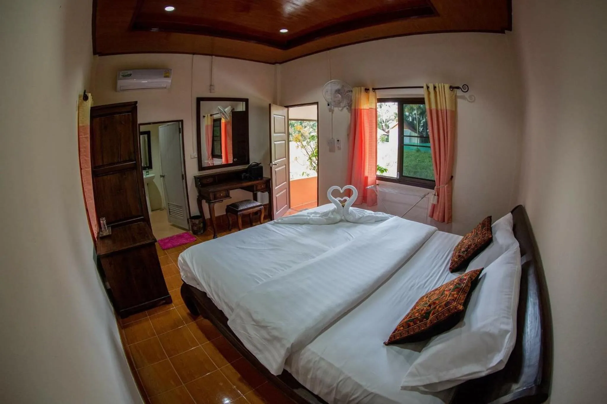 Bed in El Greco Bungalows Koh Lanta