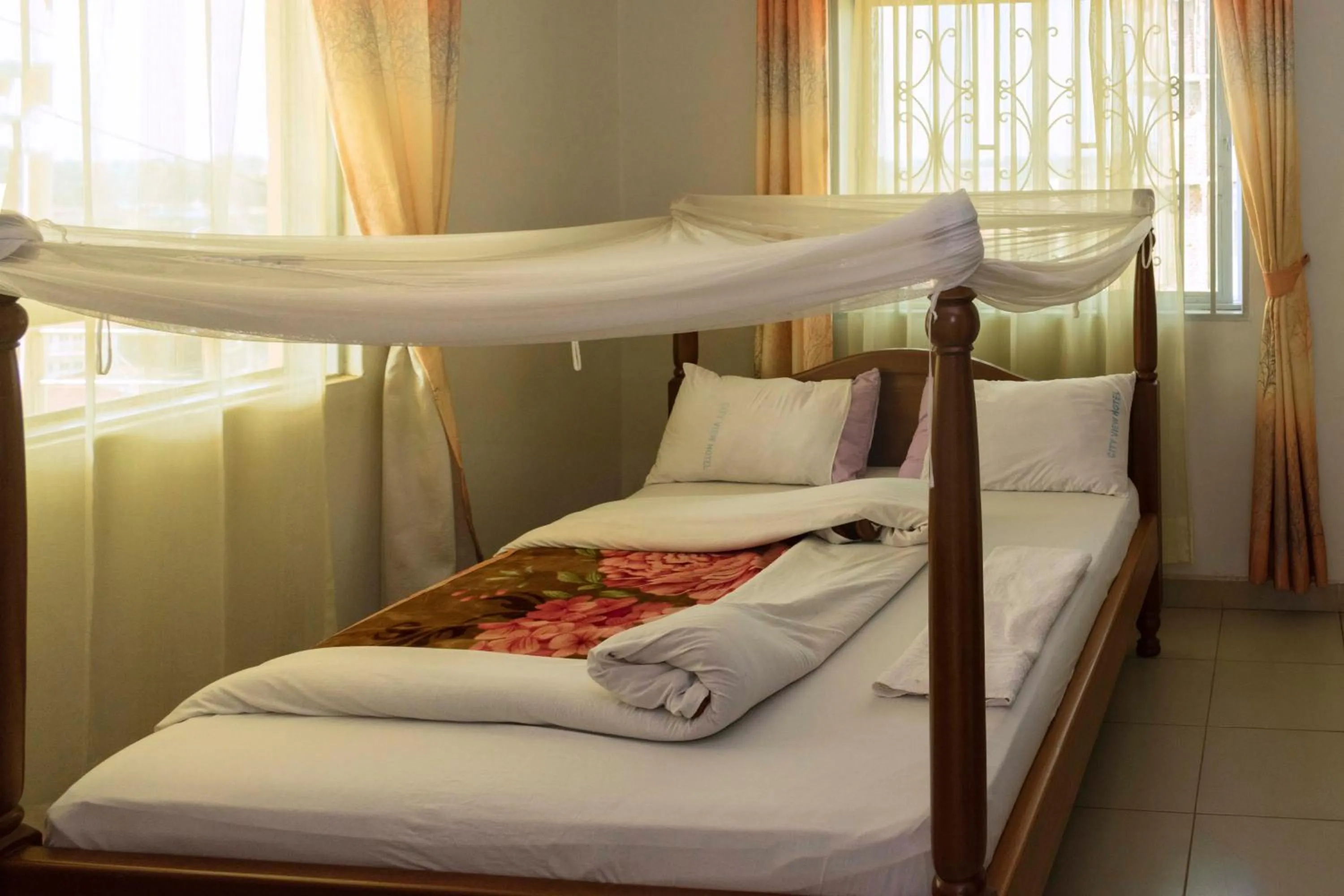 Bed in Relief Motel Fort Portal