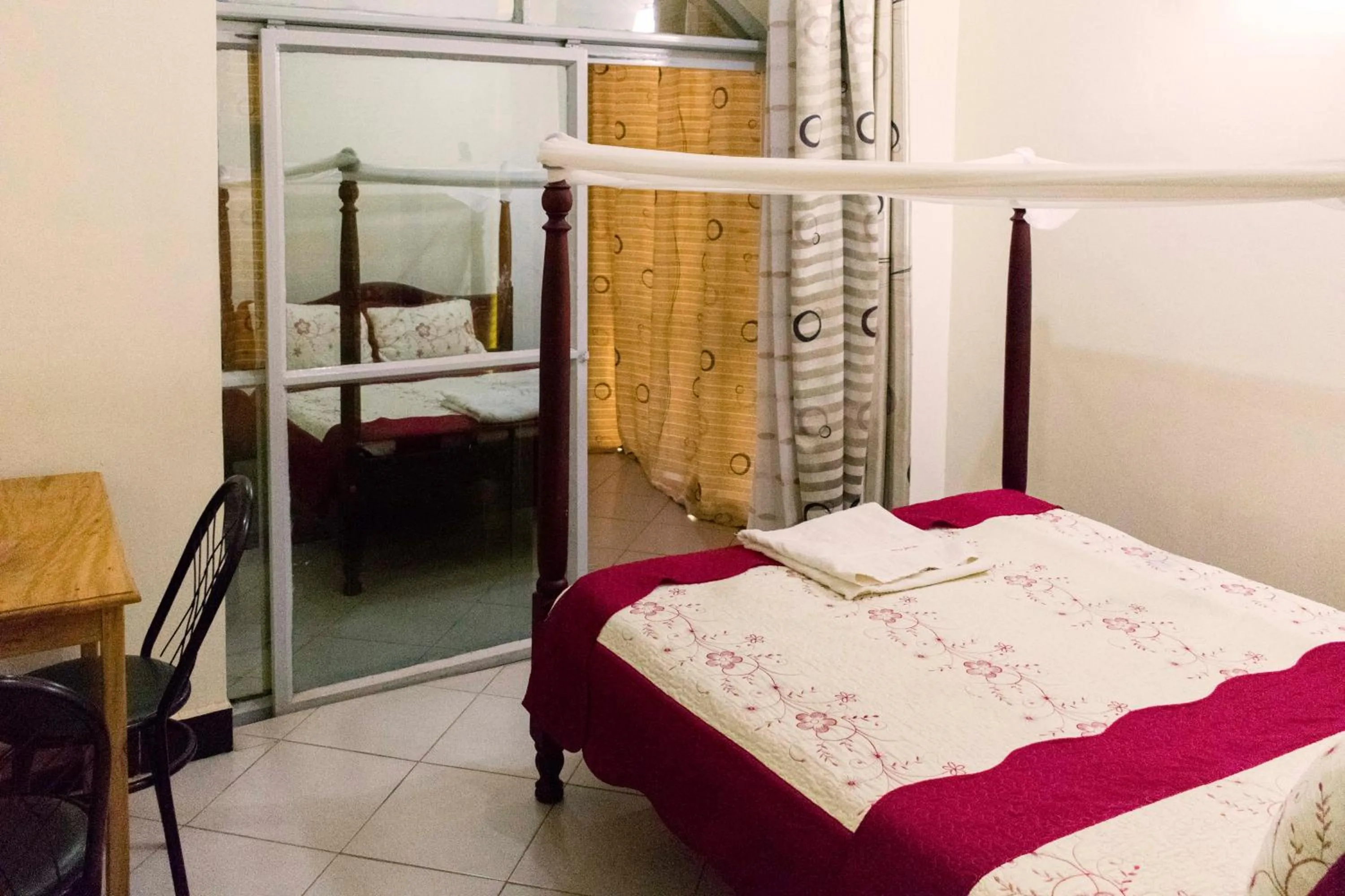 Bed in Relief Motel Fort Portal