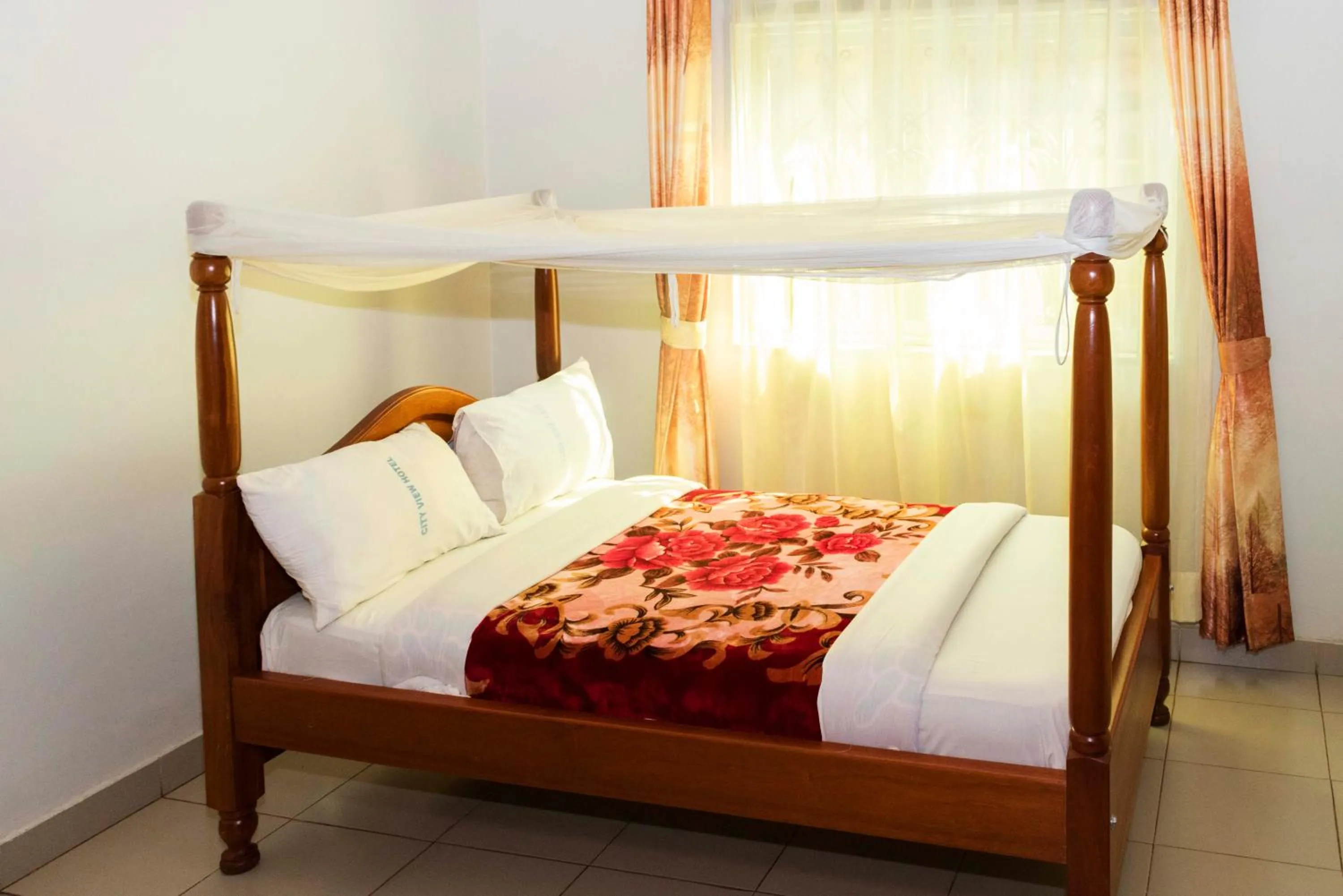 Bed in Relief Motel Fort Portal