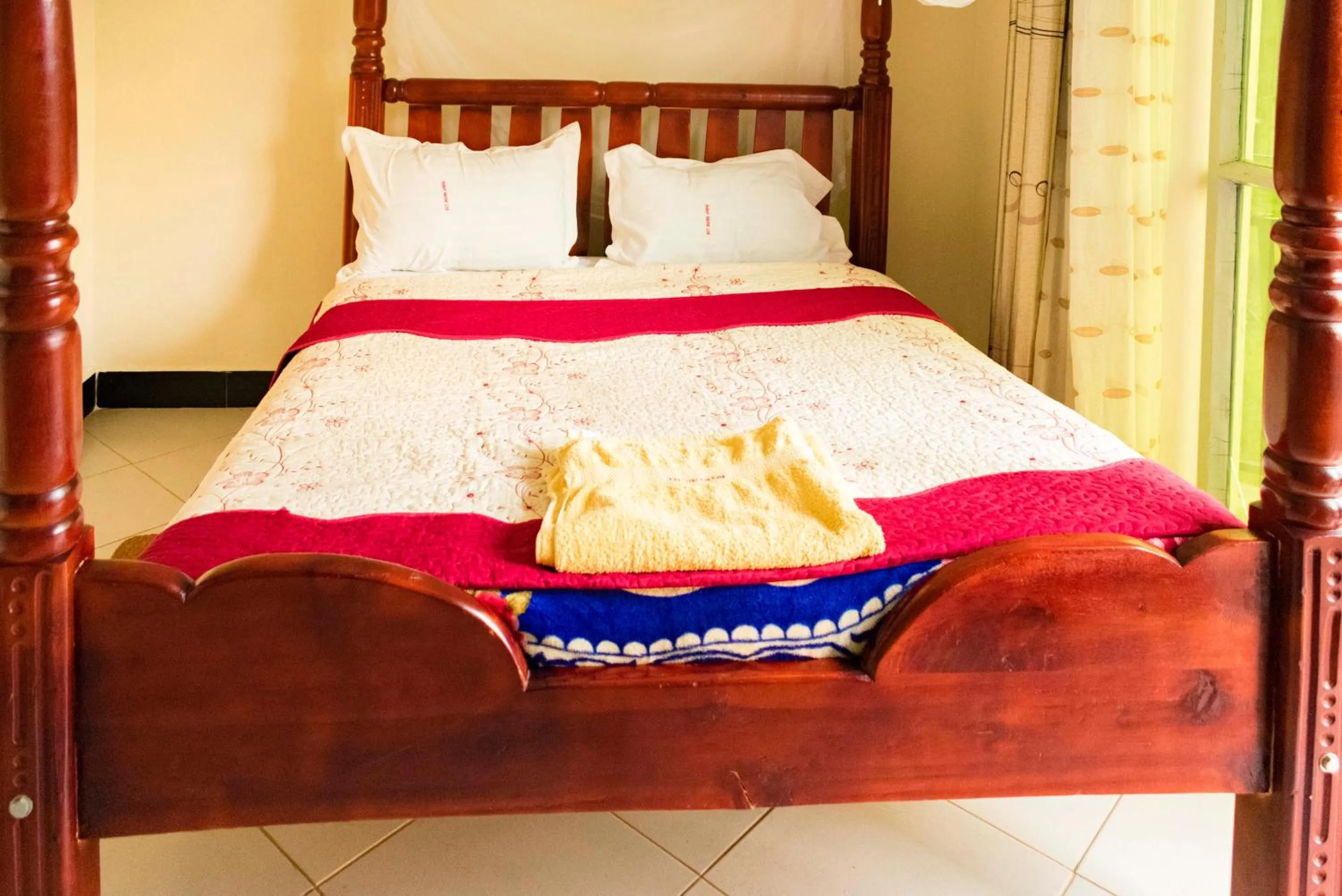 Bed in Relief Motel Fort Portal