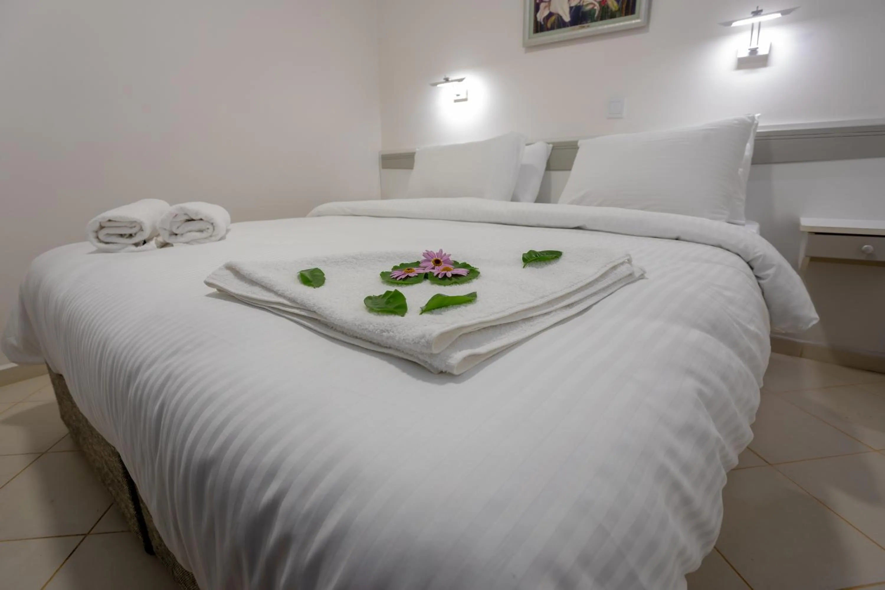 Bed in Mitos Apartments