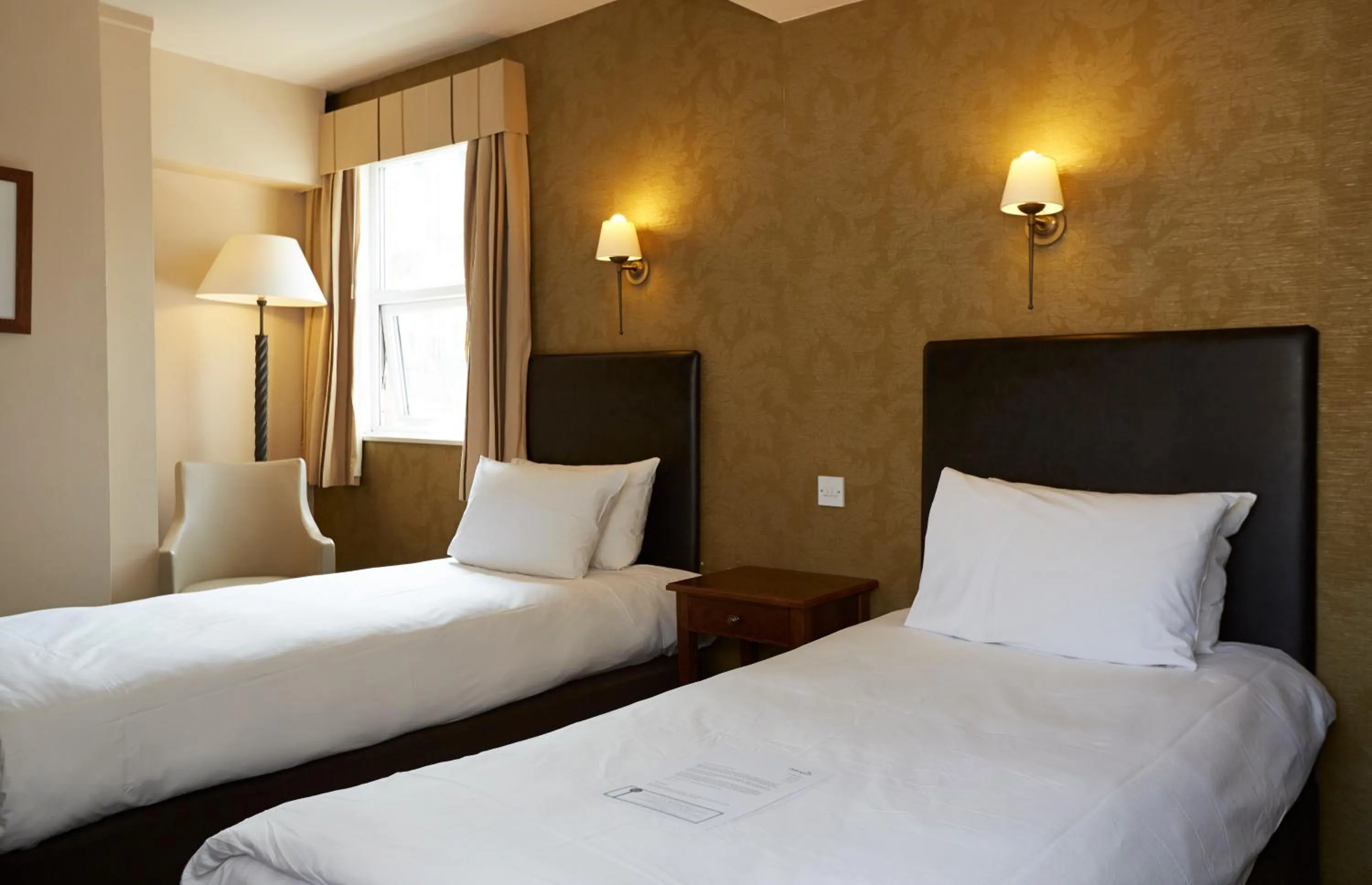 Bed in Ye Olde Talbot Hotel by Greene King Inns