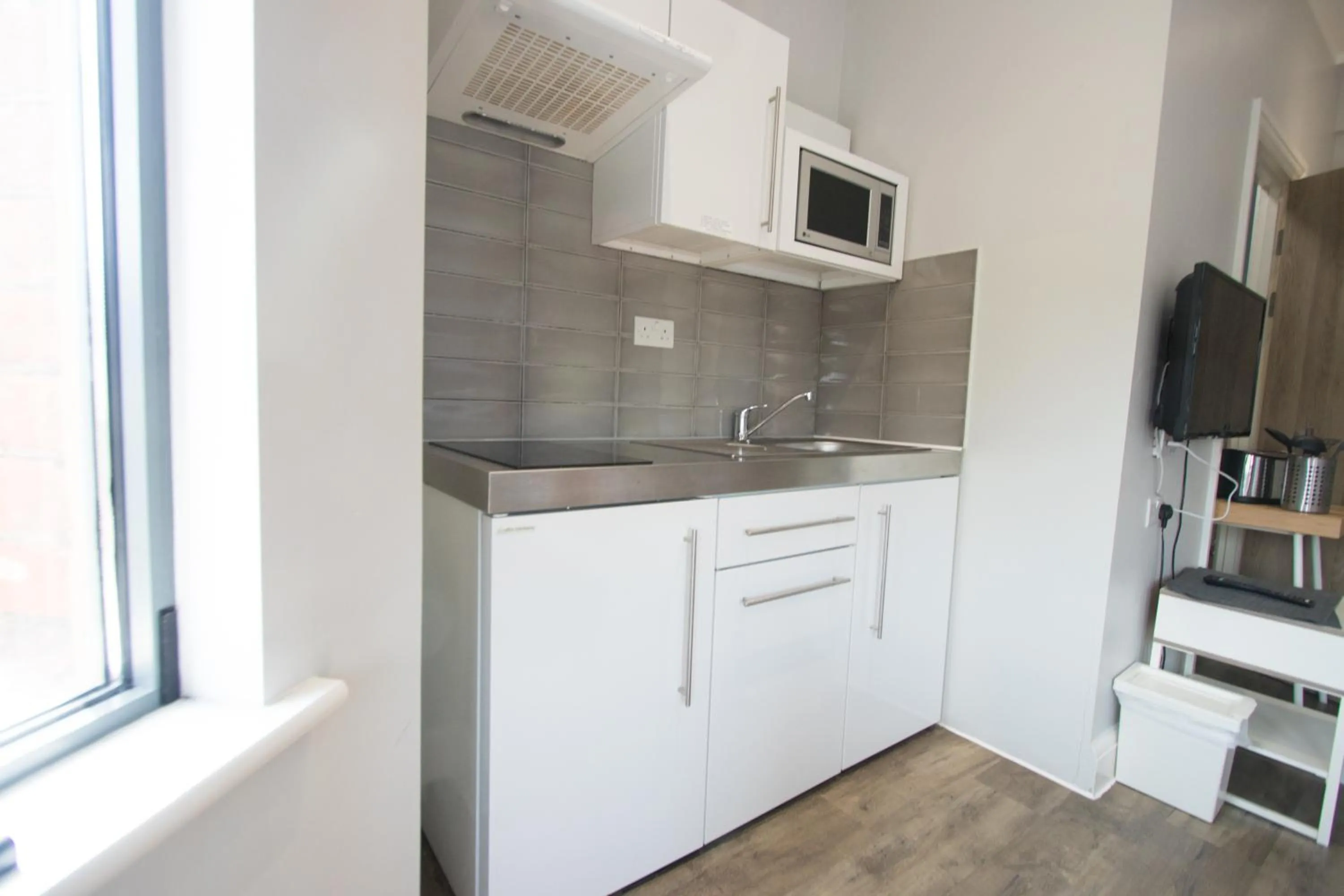 Kitchen or kitchenette in Westciti Caroco Aparthotel