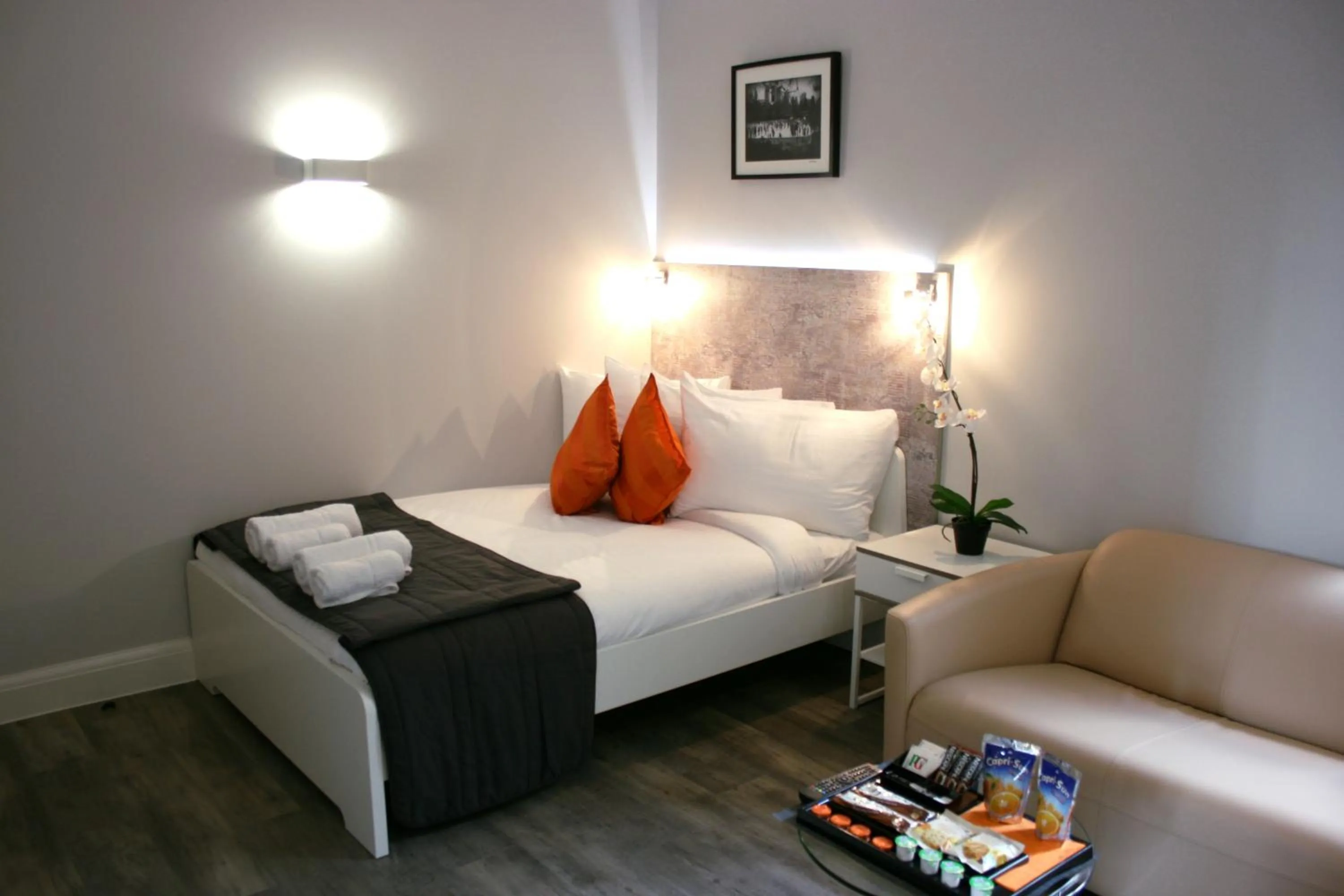 Bed in Westciti Caroco Aparthotel