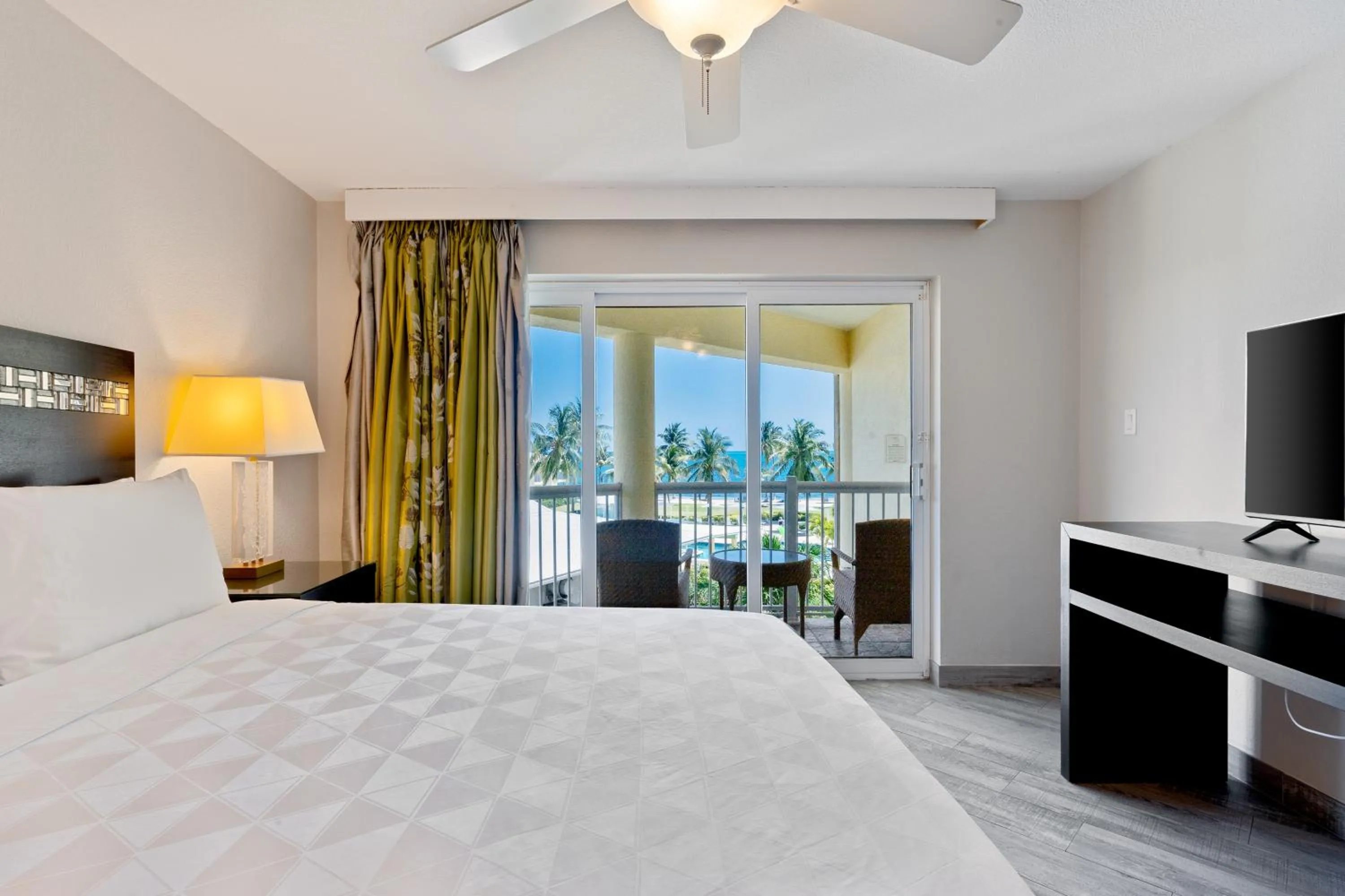Bed in The Grand Caymanian Resort