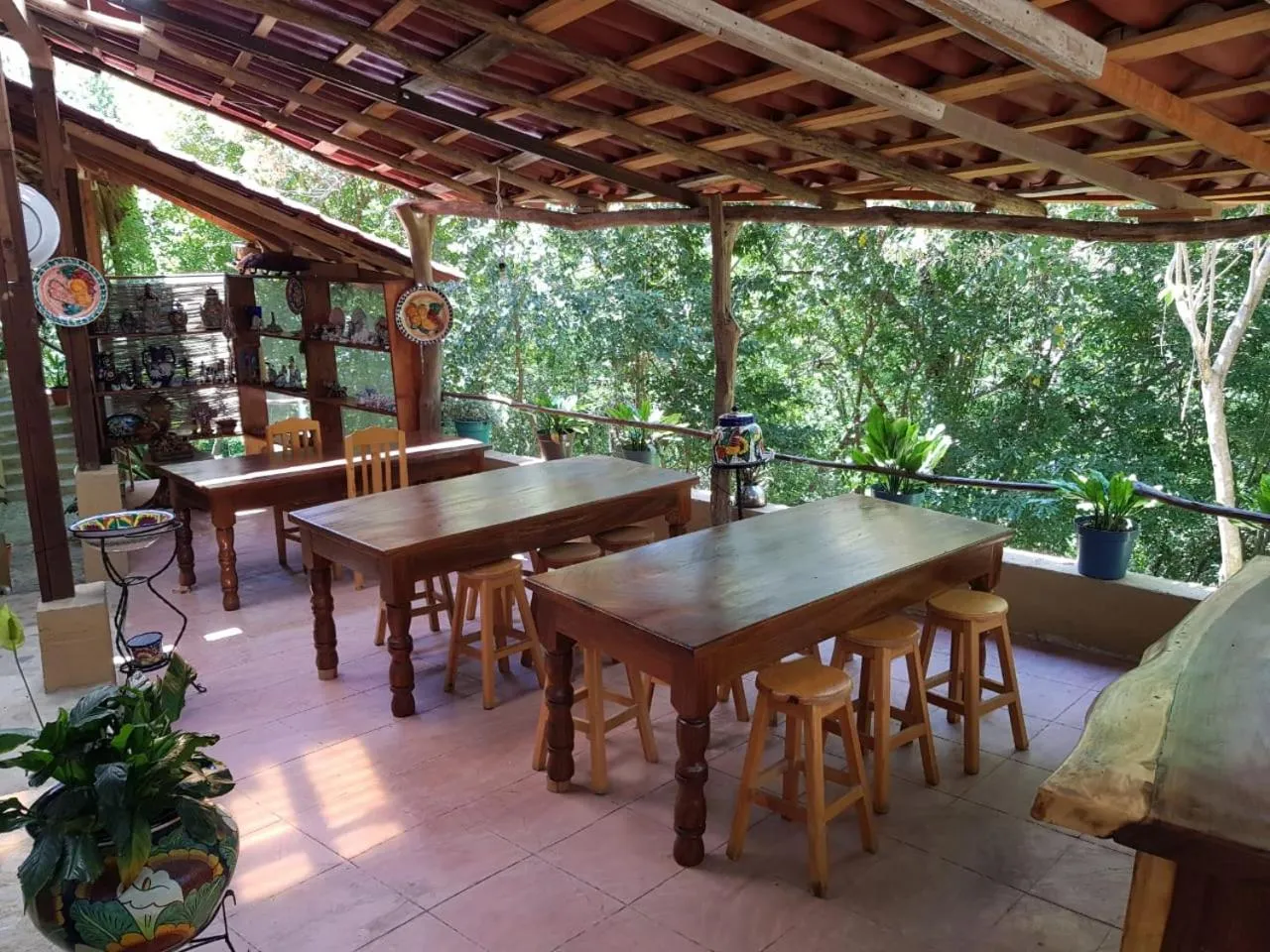 Communal lounge/ TV room in El Eden Bungalows