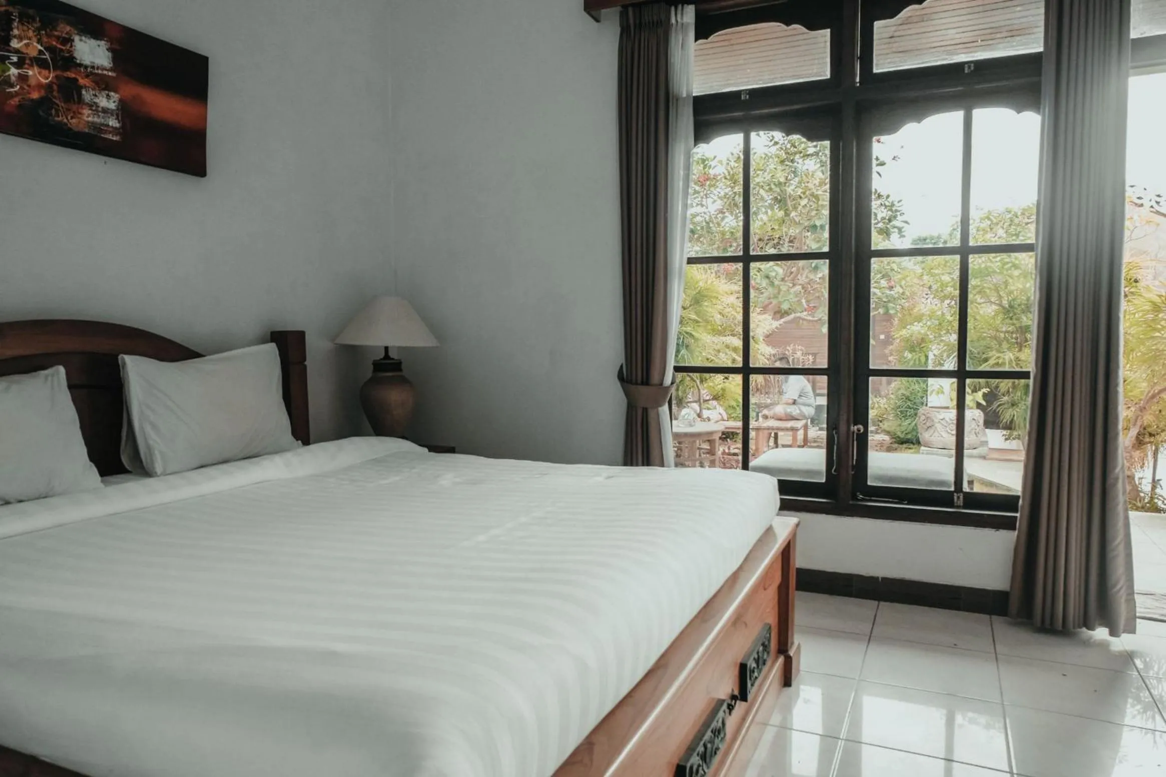 Photo of the whole room, Bed in Sekar Arum Riverside Resort in Canggu