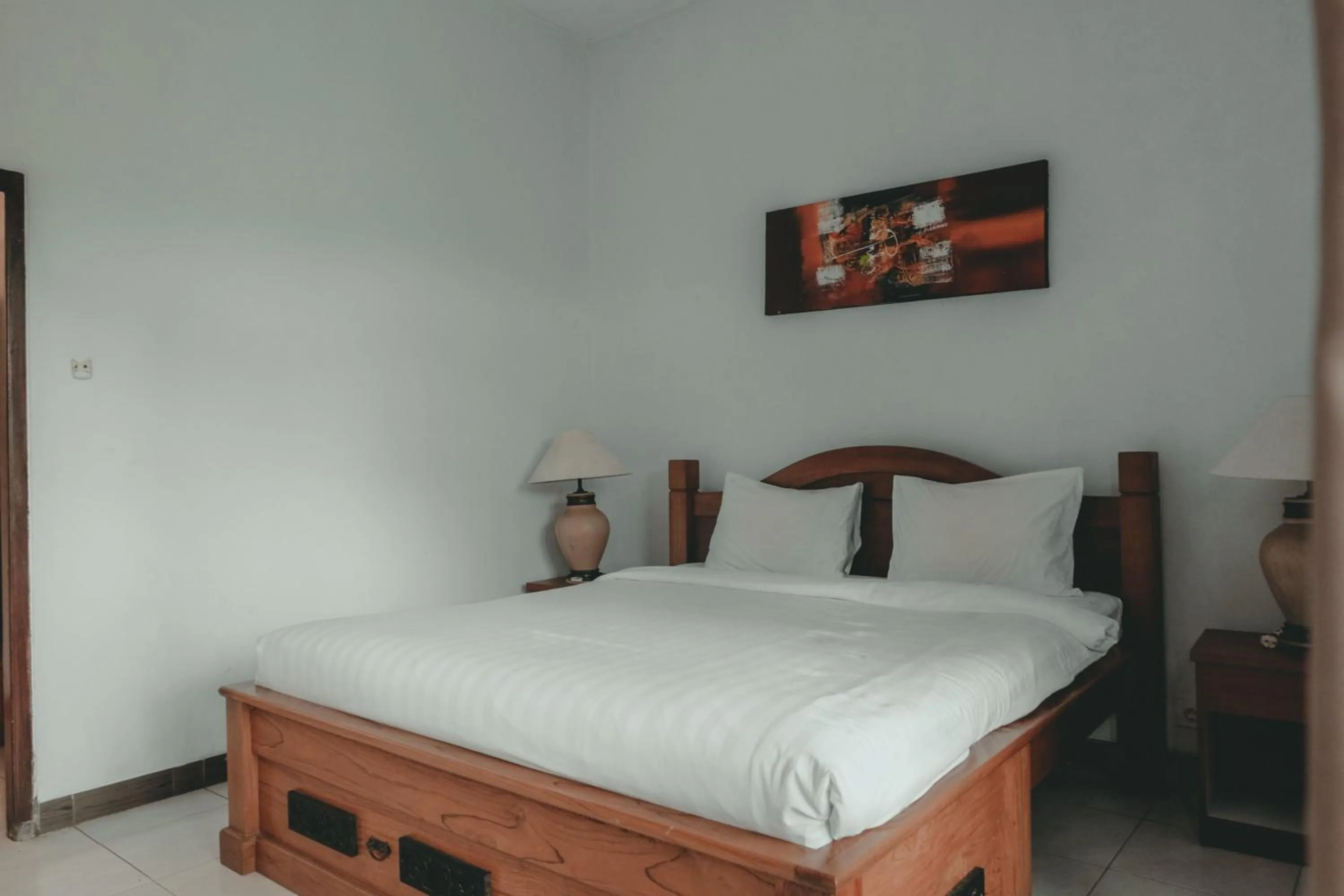 Photo of the whole room, Bed in Sekar Arum Riverside Resort in Canggu
