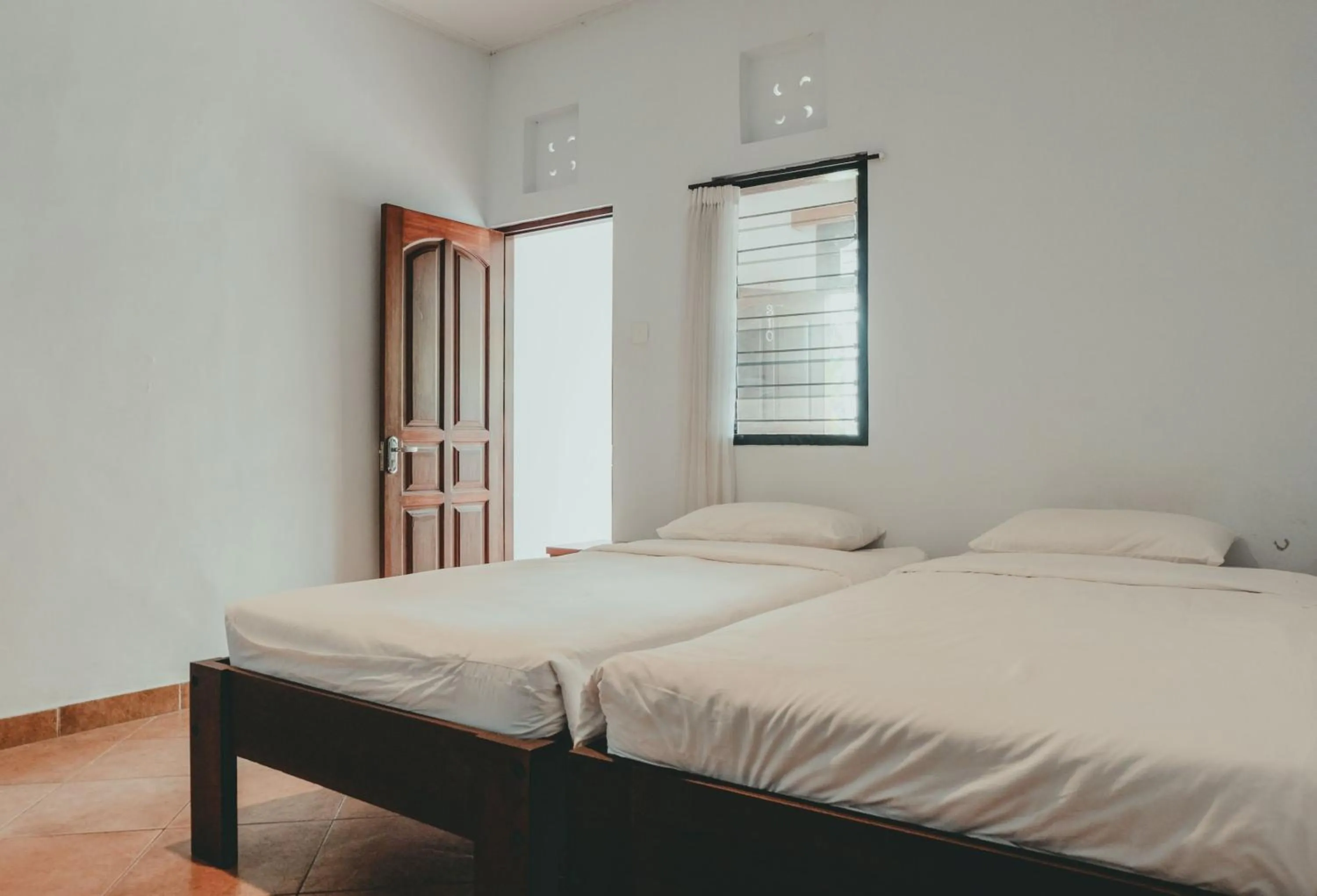 Photo of the whole room, Bed in Sekar Arum Riverside Resort in Canggu