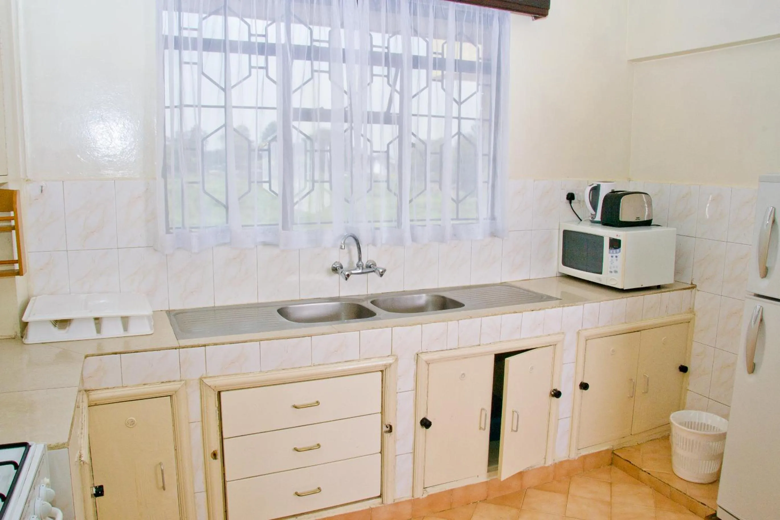 Kitchen or kitchenette in Njema Court Apartment