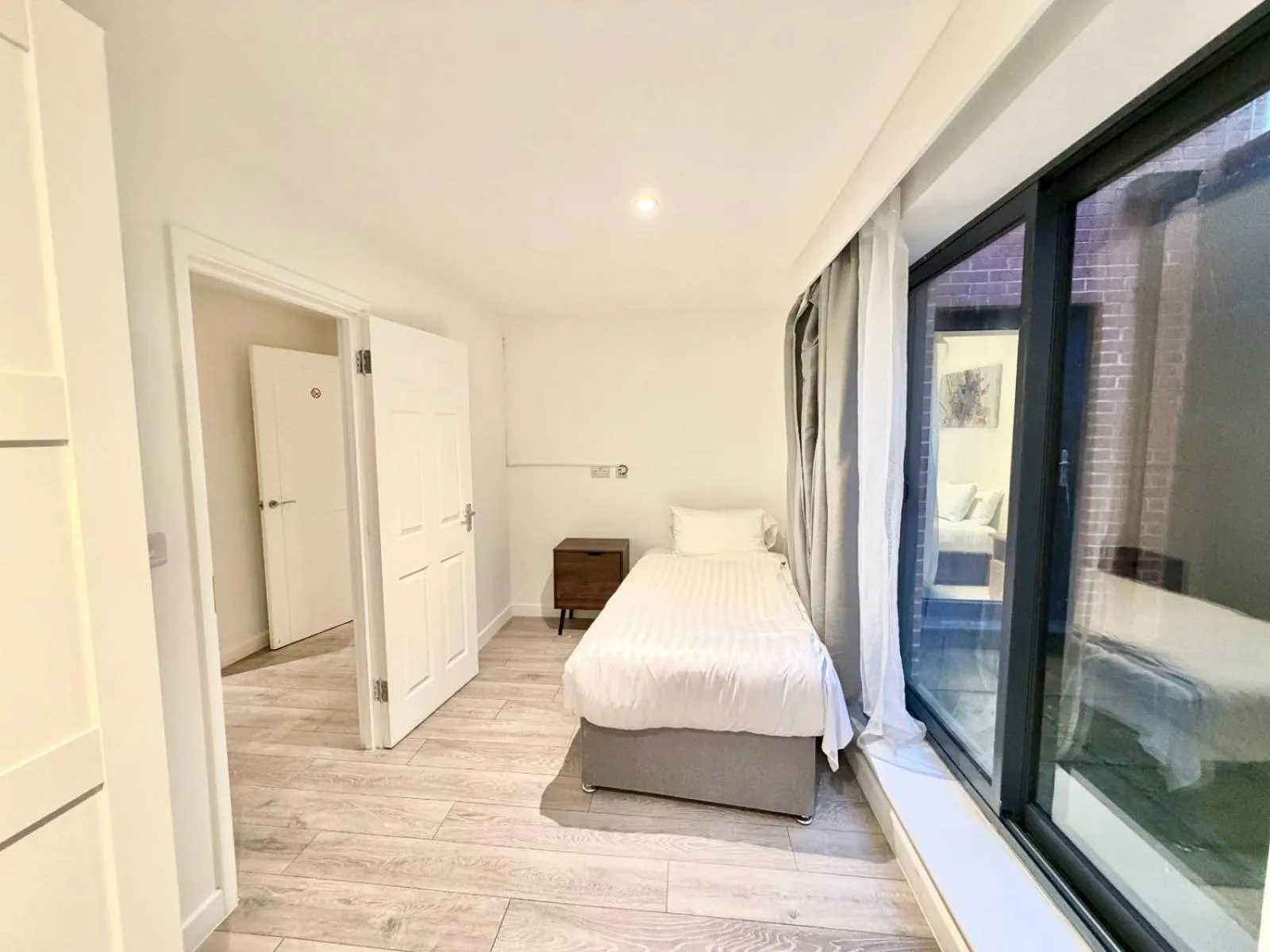 Bed in Hampton Suites Serviced Apartments