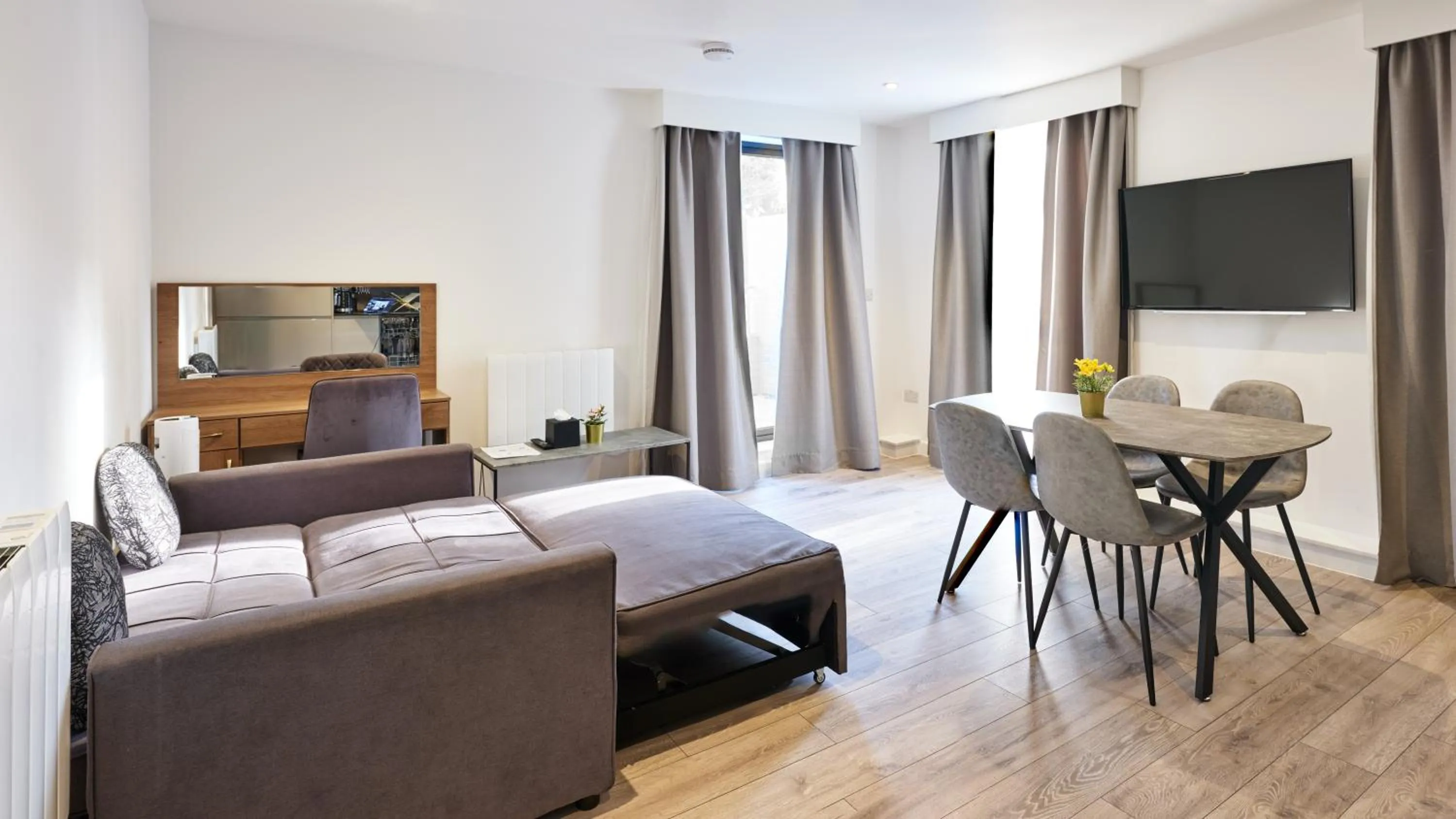 Bed in Hampton Suites Serviced Apartments