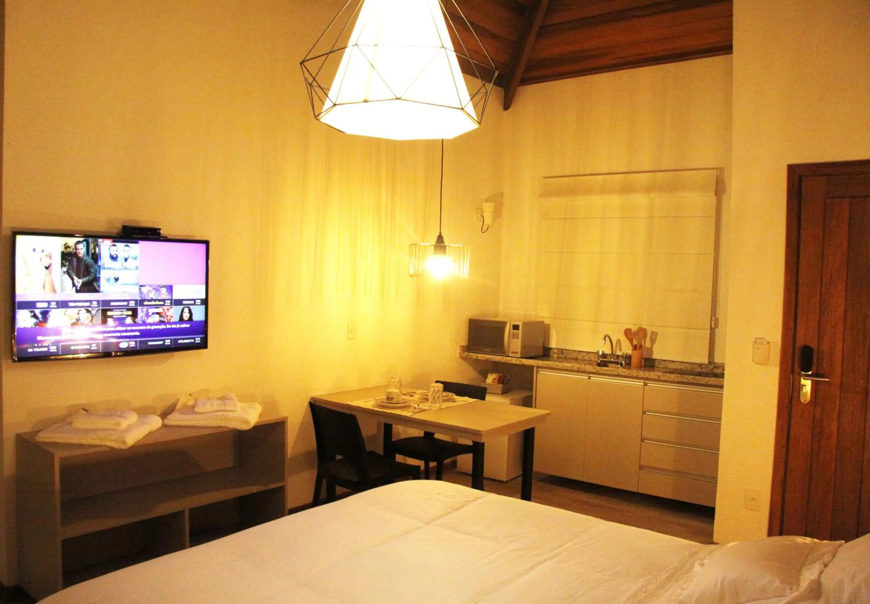 Kitchen or kitchenette, Bed in Resort Magnifico