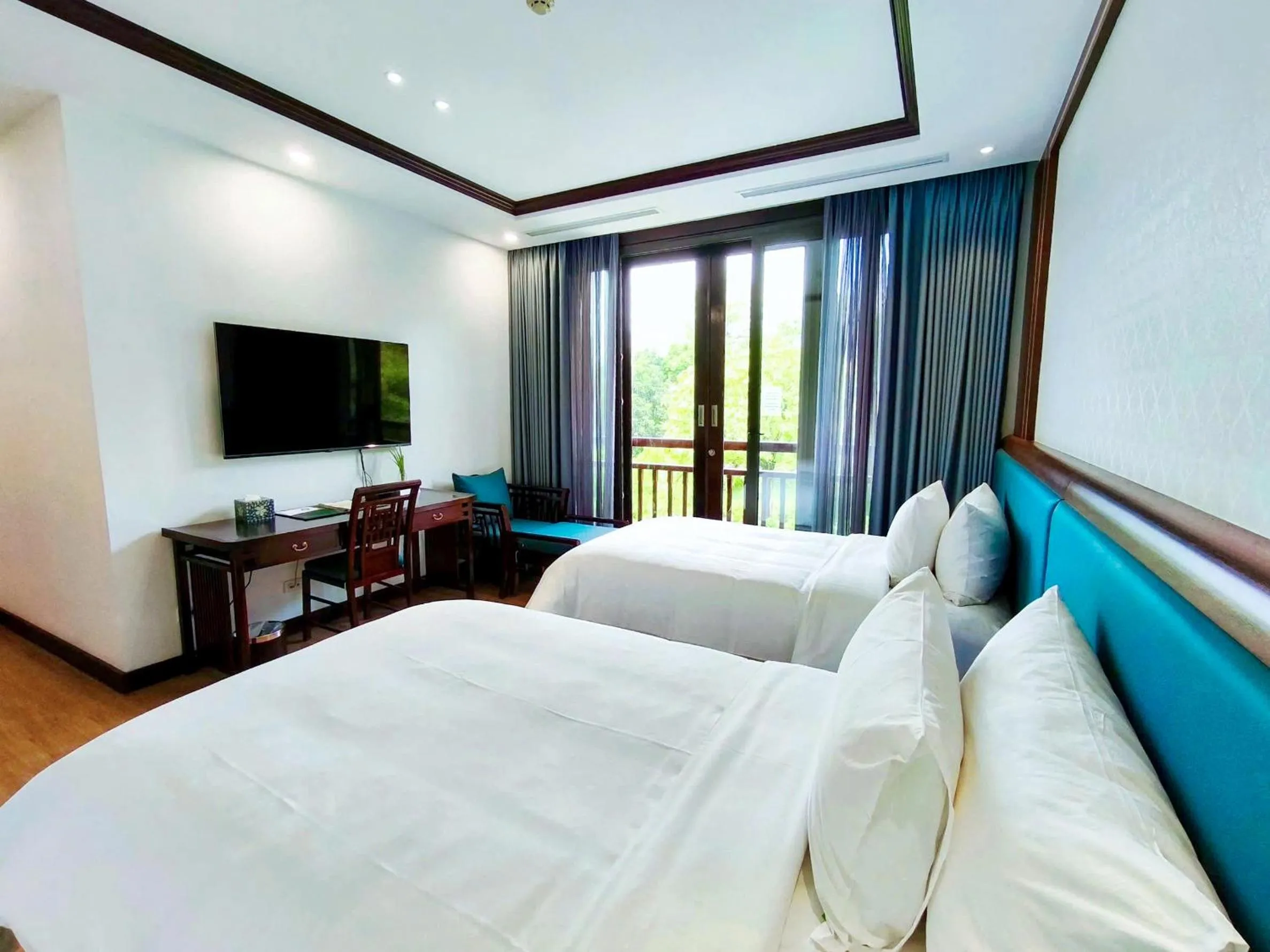 Bed in NCC Garden Villas - NCC Hotel