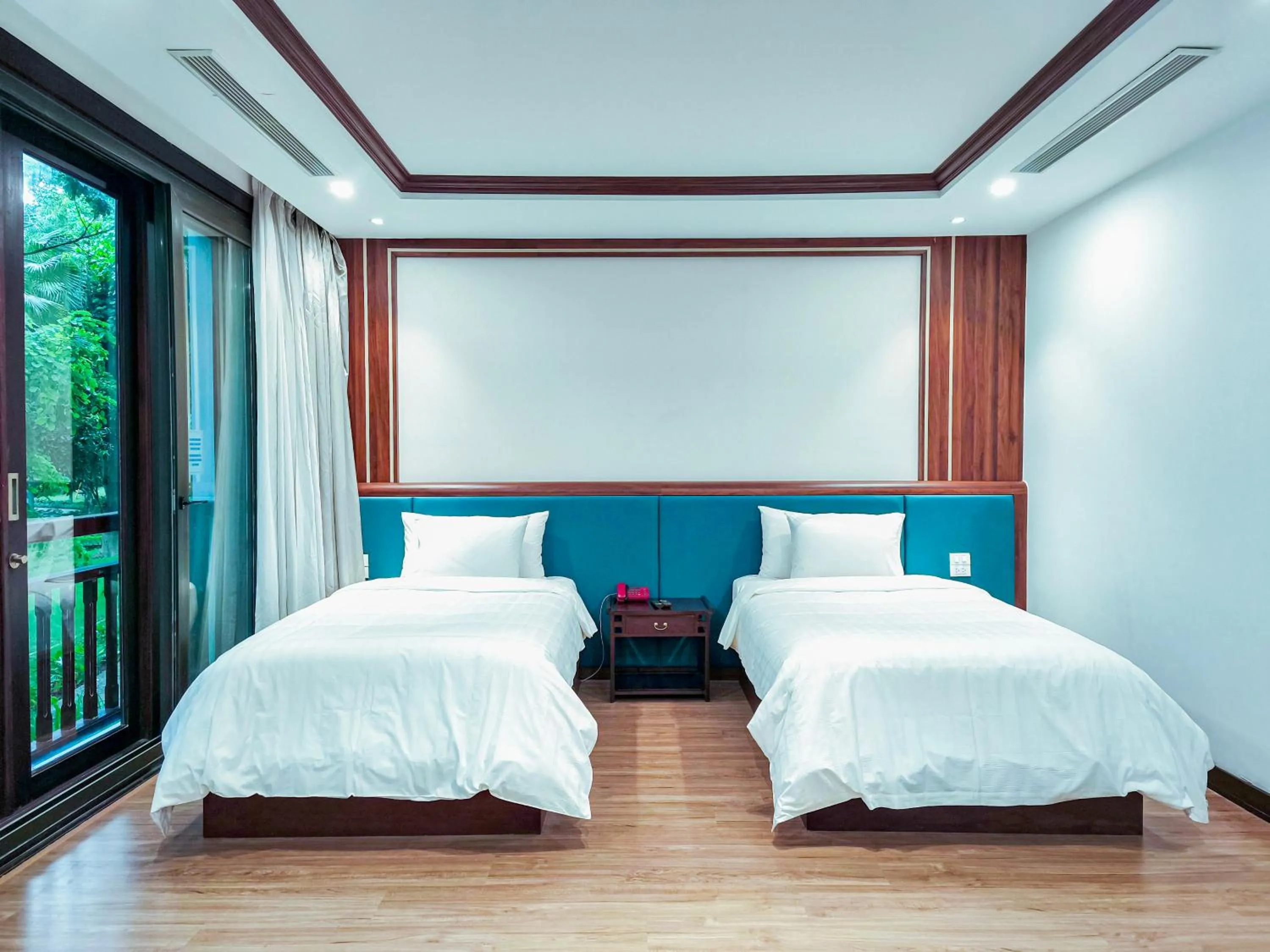 Bed in NCC Garden Villas - NCC Hotel