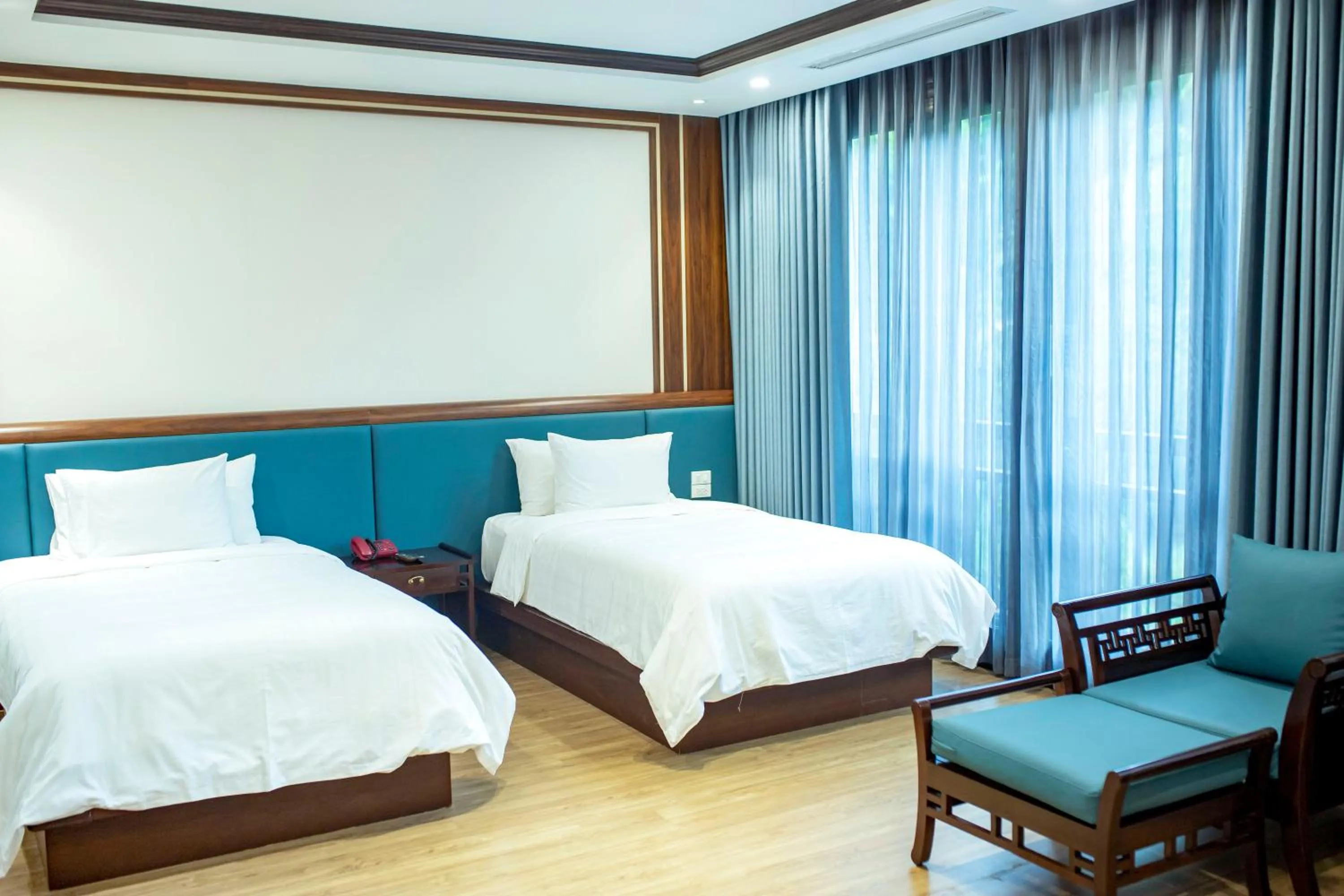 Bed in NCC Garden Villas - NCC Hotel