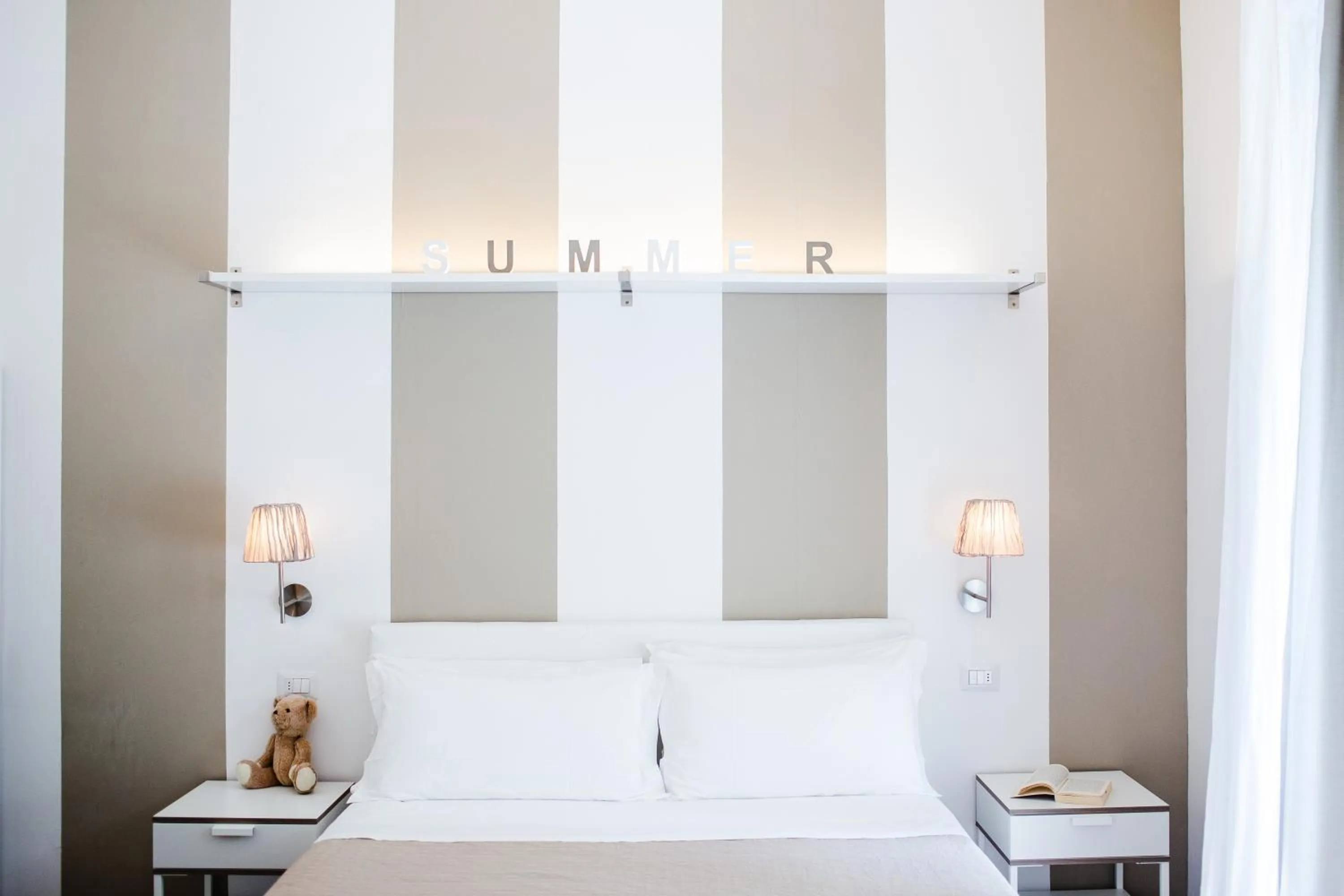 Bed in De La Ville Hotel