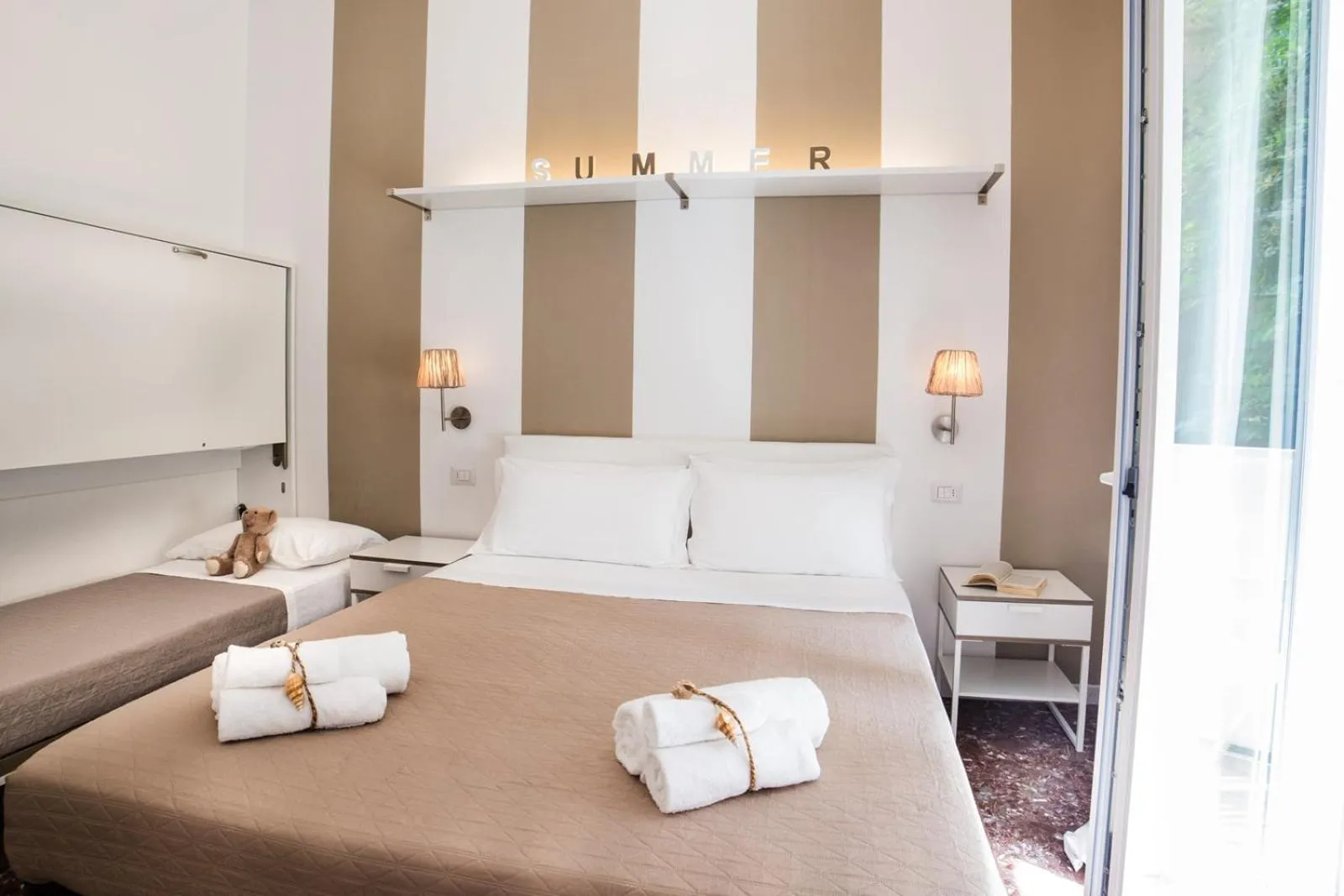 Bed in De La Ville Hotel