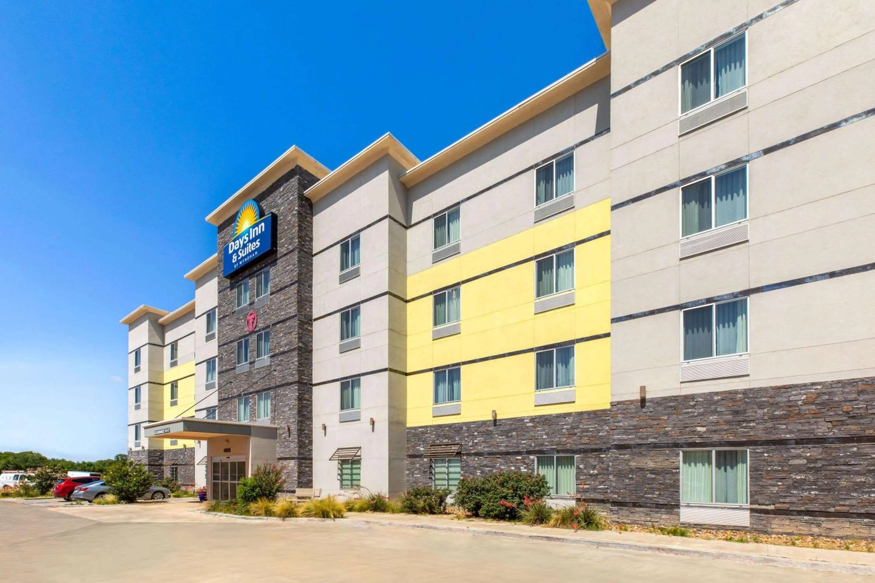 Property building in Days Inn & Suites by Wyndham Lubbock Medical Center