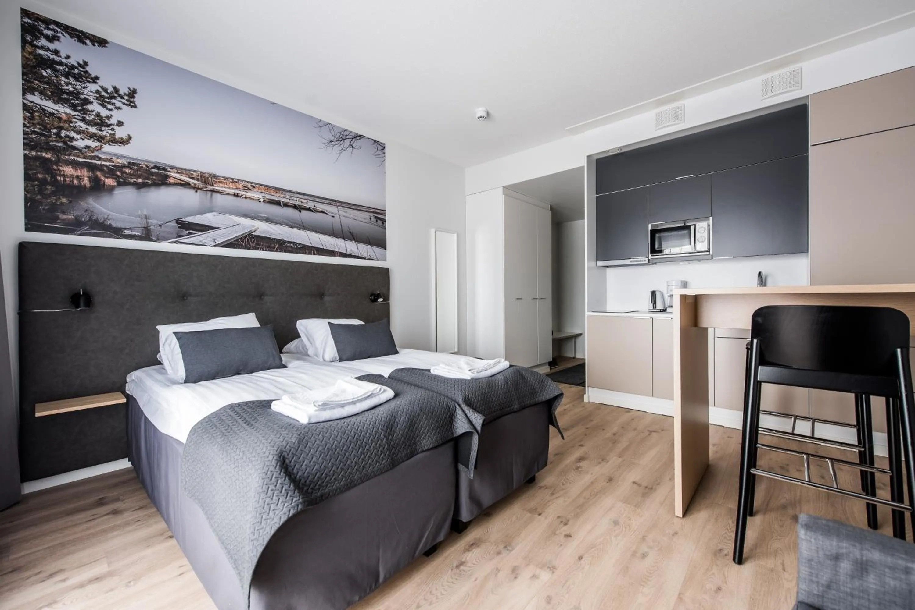 Kitchen or kitchenette, Bed in Forenom Aparthotel Kempele