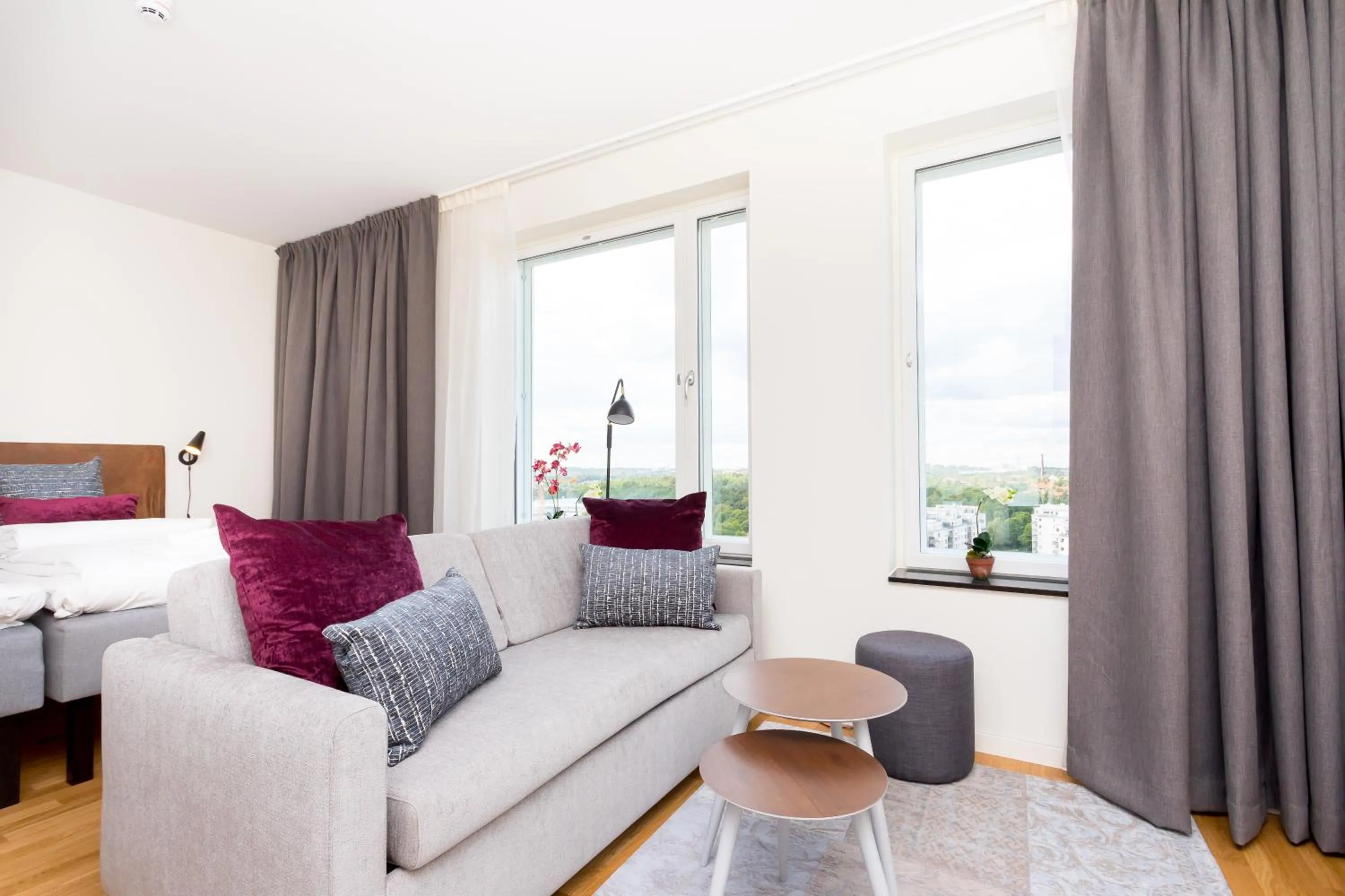 Living room, Bed in ApartDirect Älvsjö