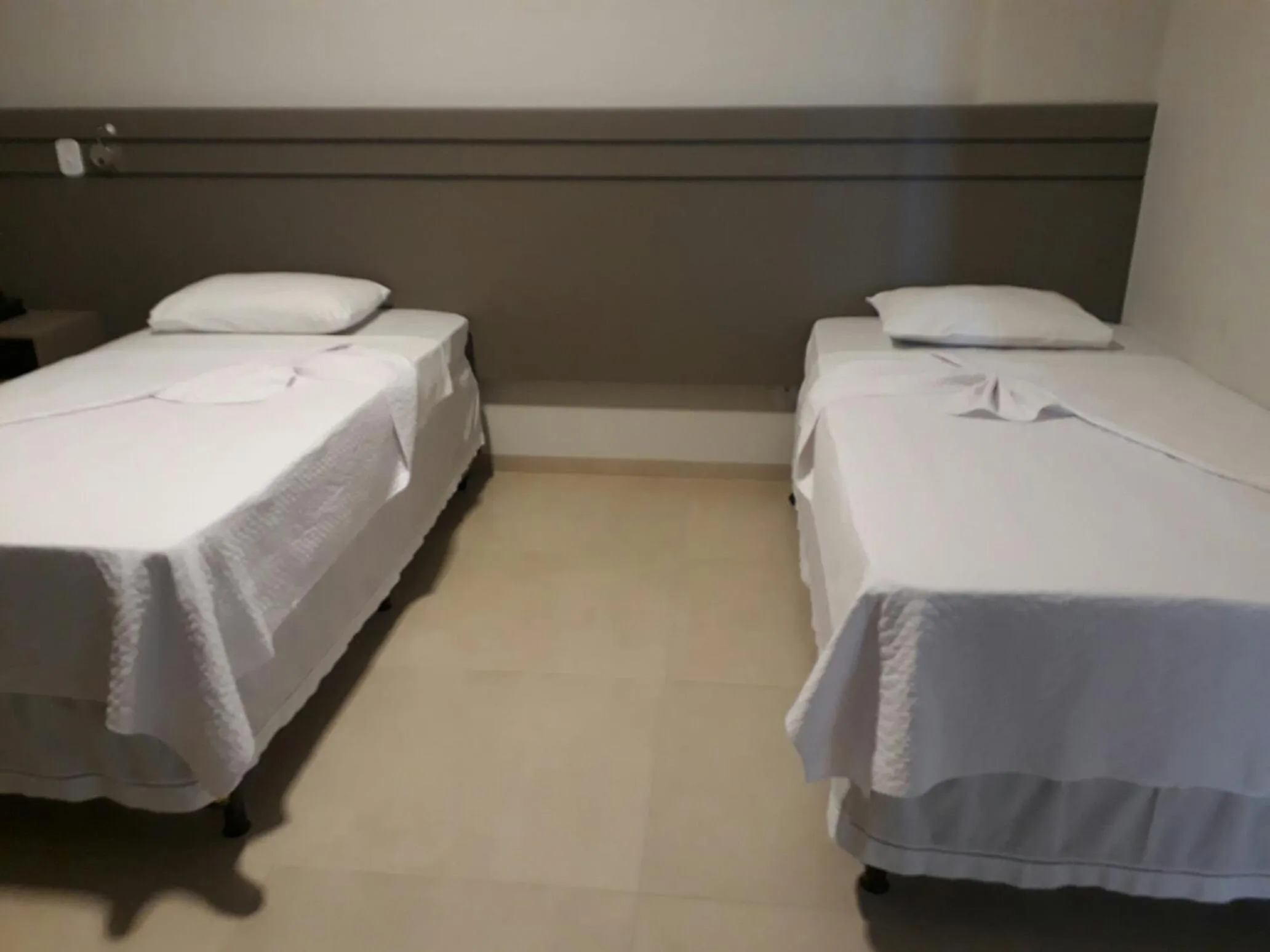 Bed in Pak Suítes Hotel