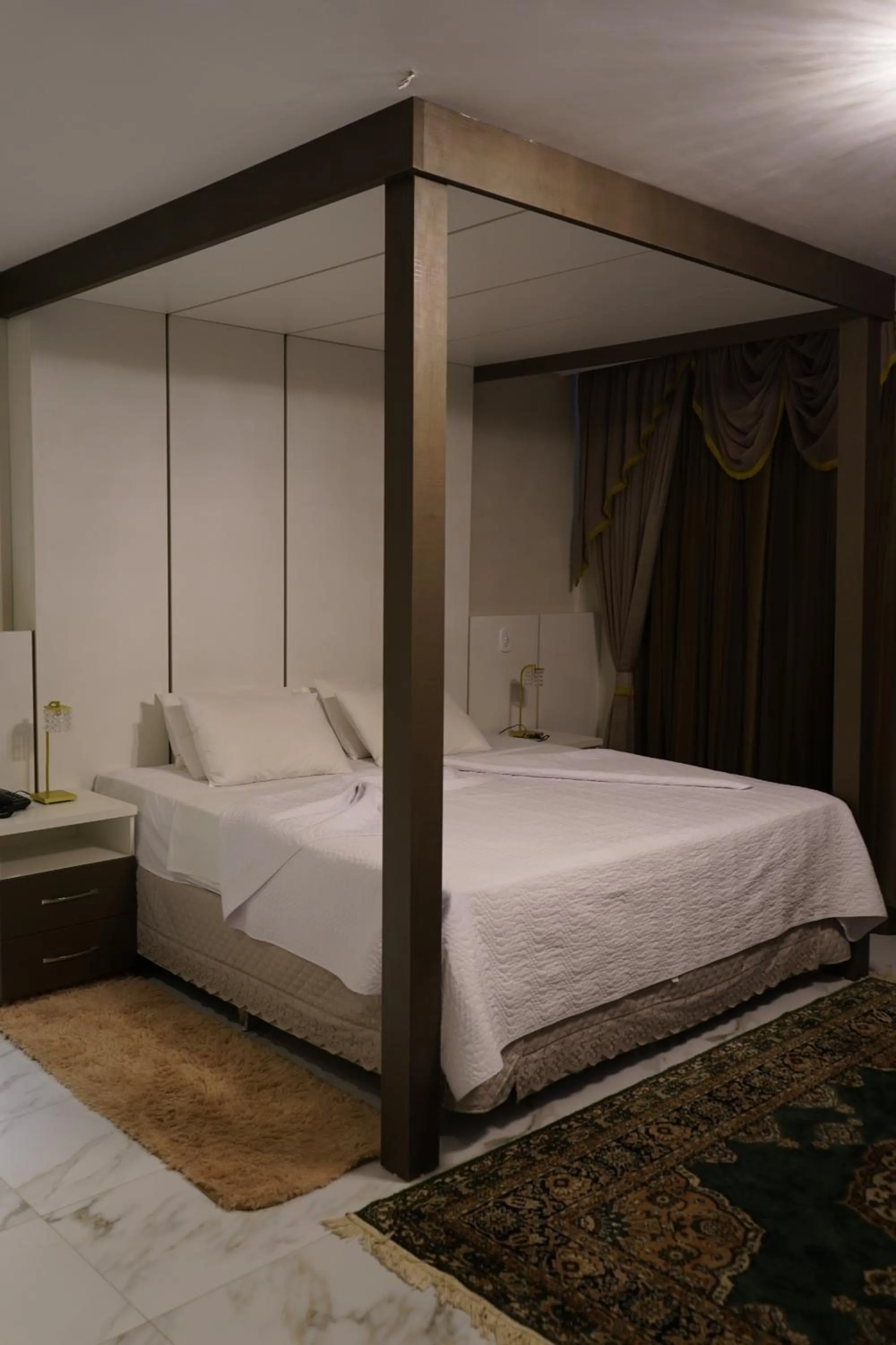 Bed in Pak Suítes Hotel