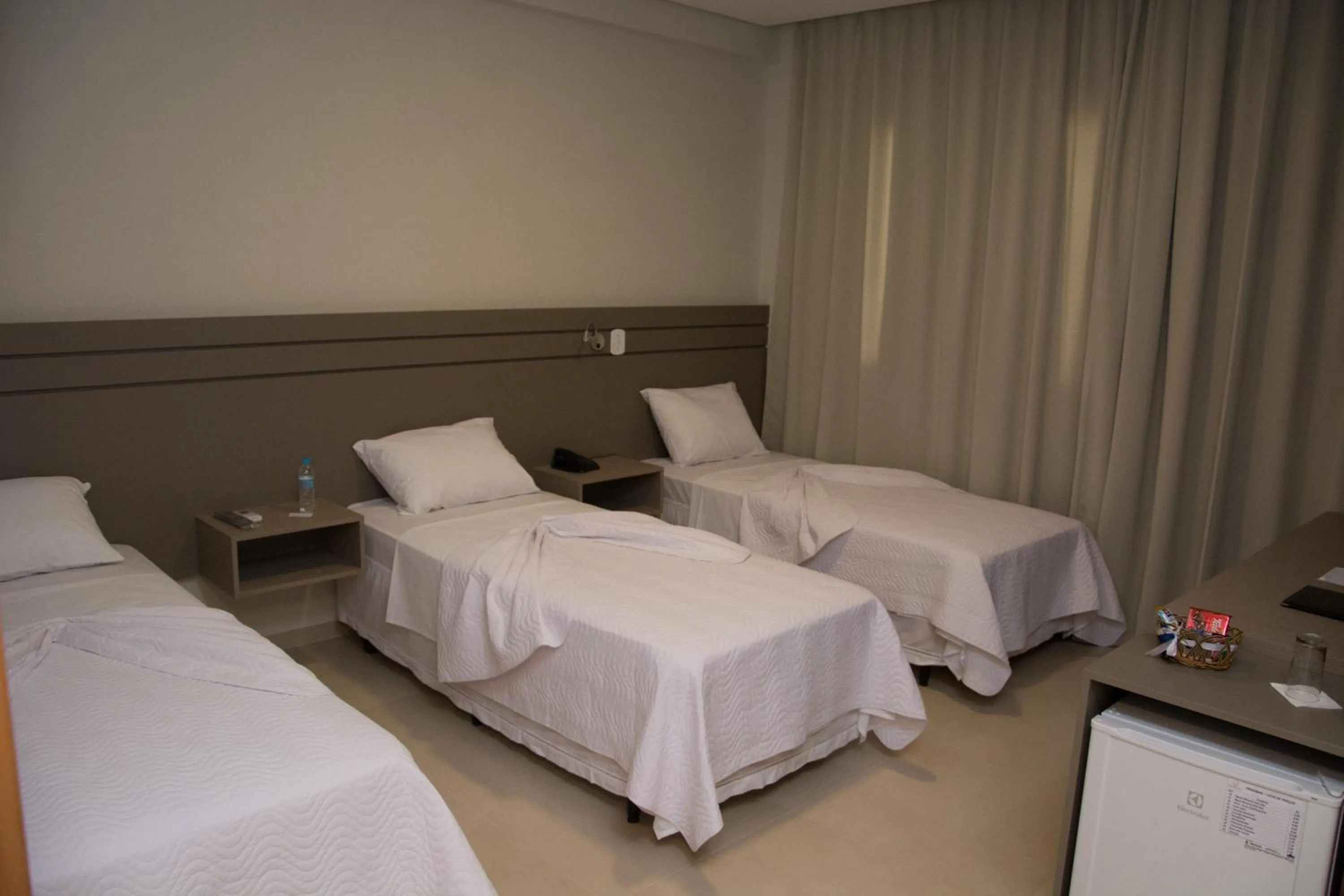 Bed in Pak Suítes Hotel