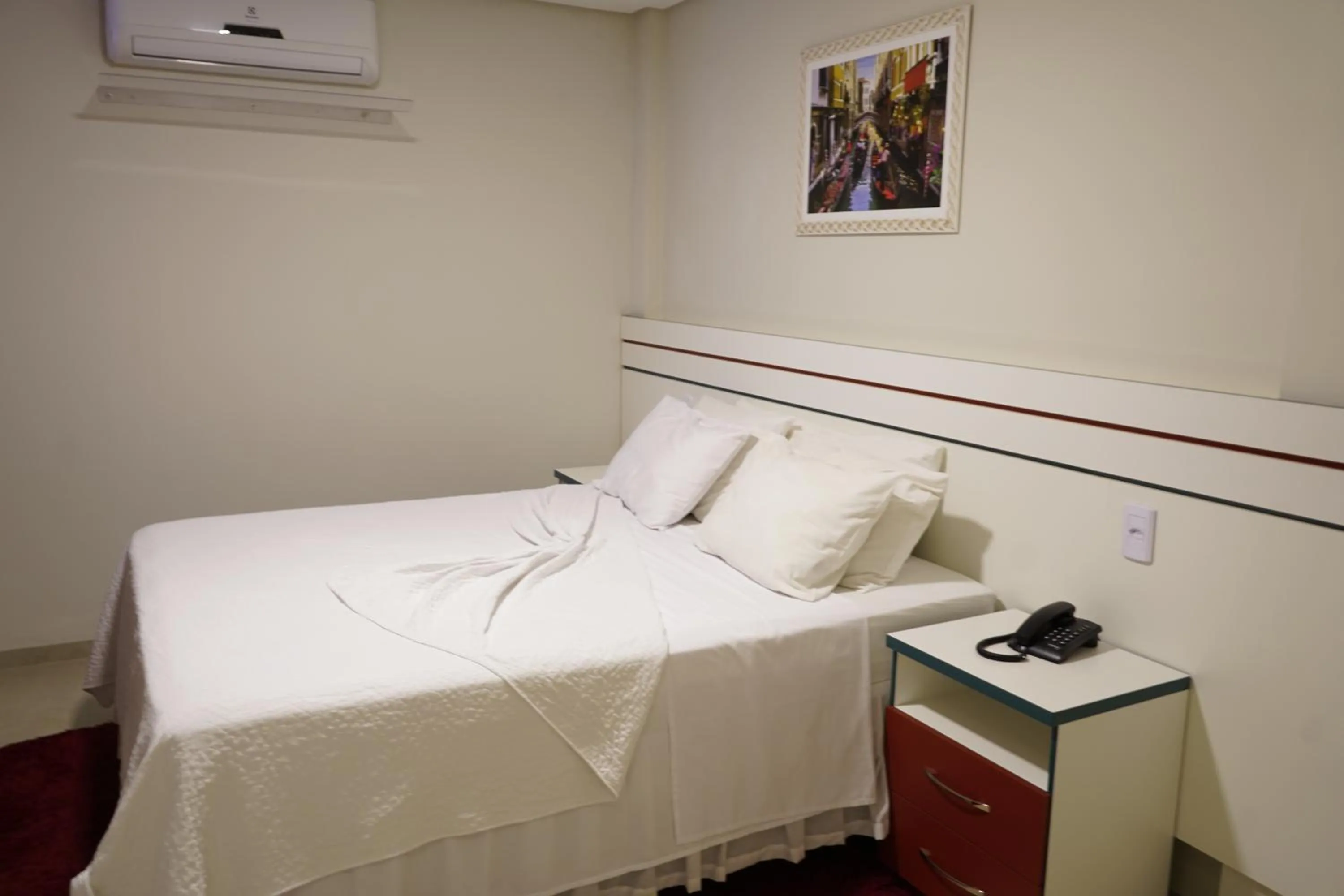 Bed in Pak Suítes Hotel