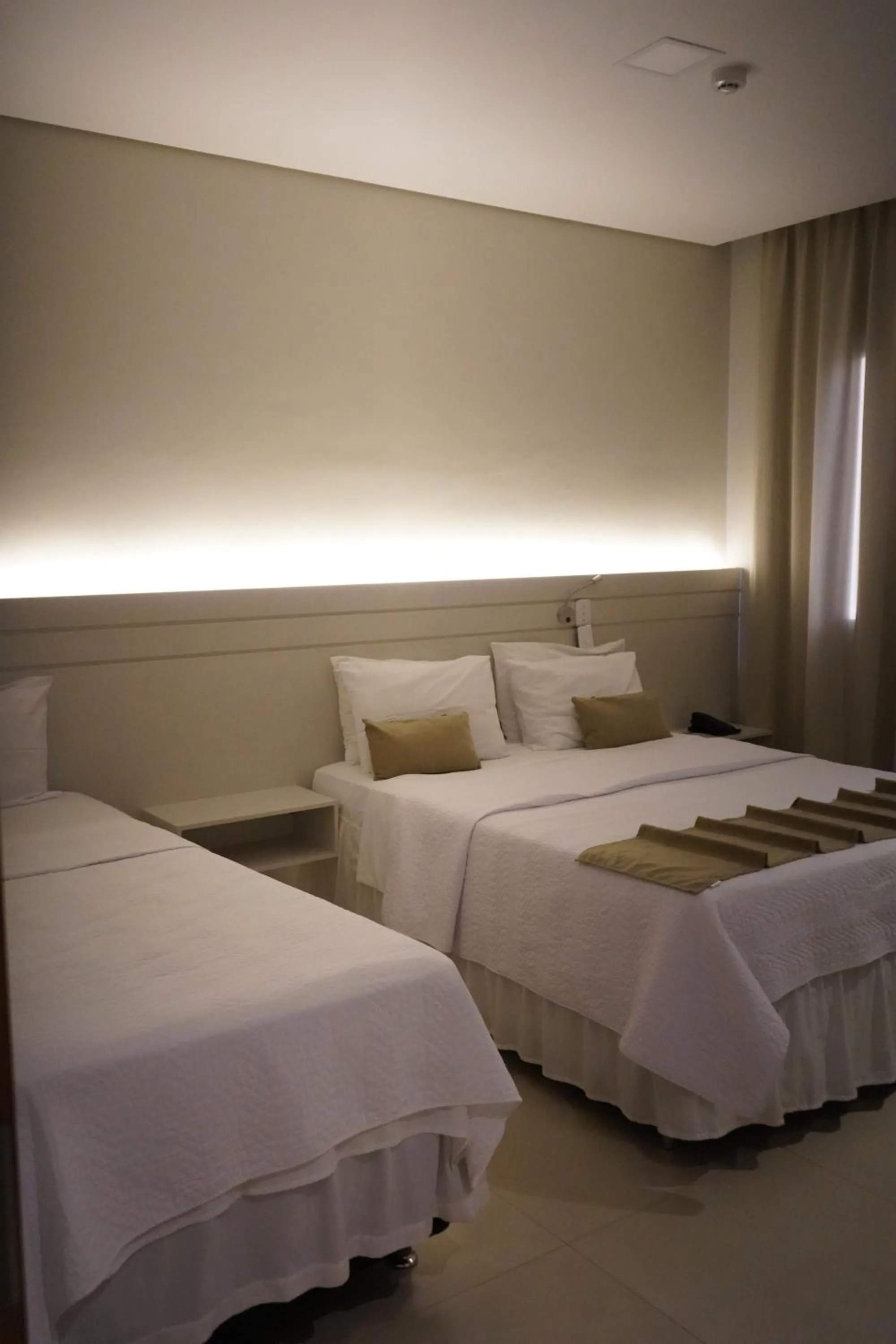 Bed in Pak Suítes Hotel