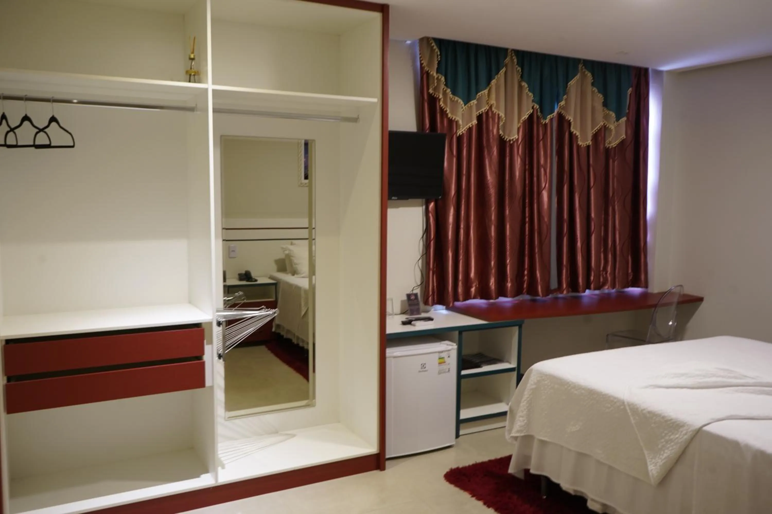 Bed in Pak Suítes Hotel