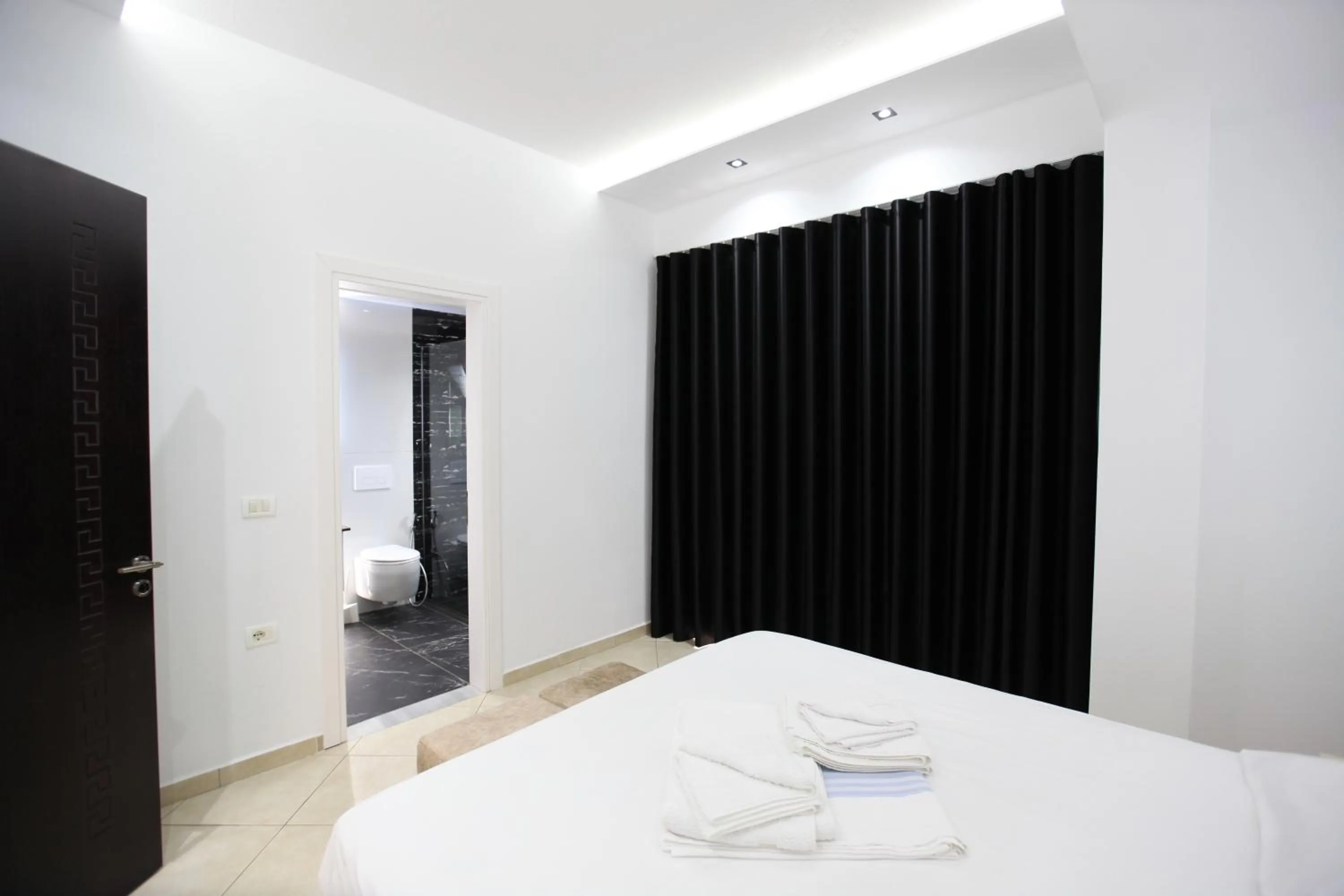 Bed in Ksamil Central Park Hotel