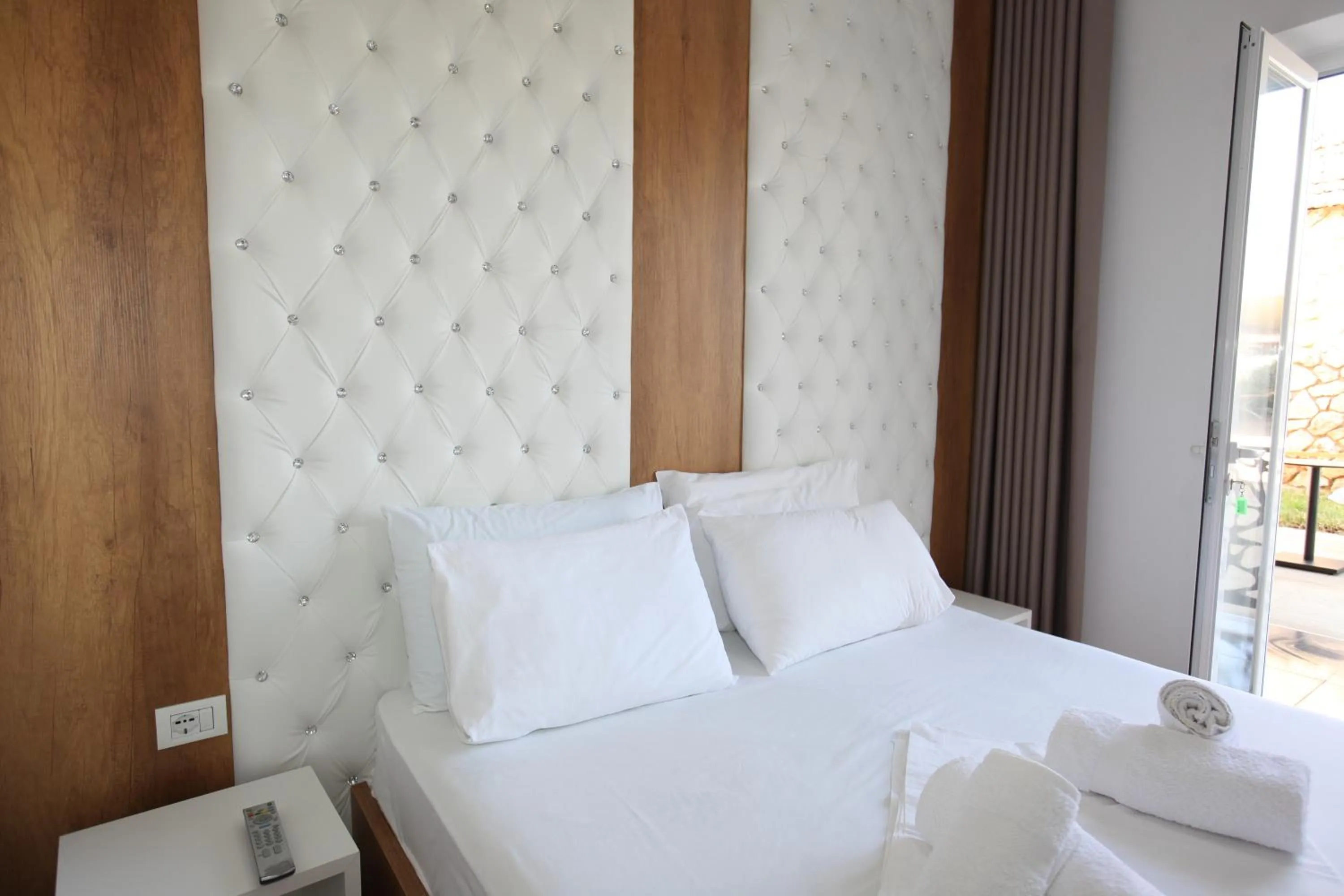 Bed in Ksamil Central Park Hotel