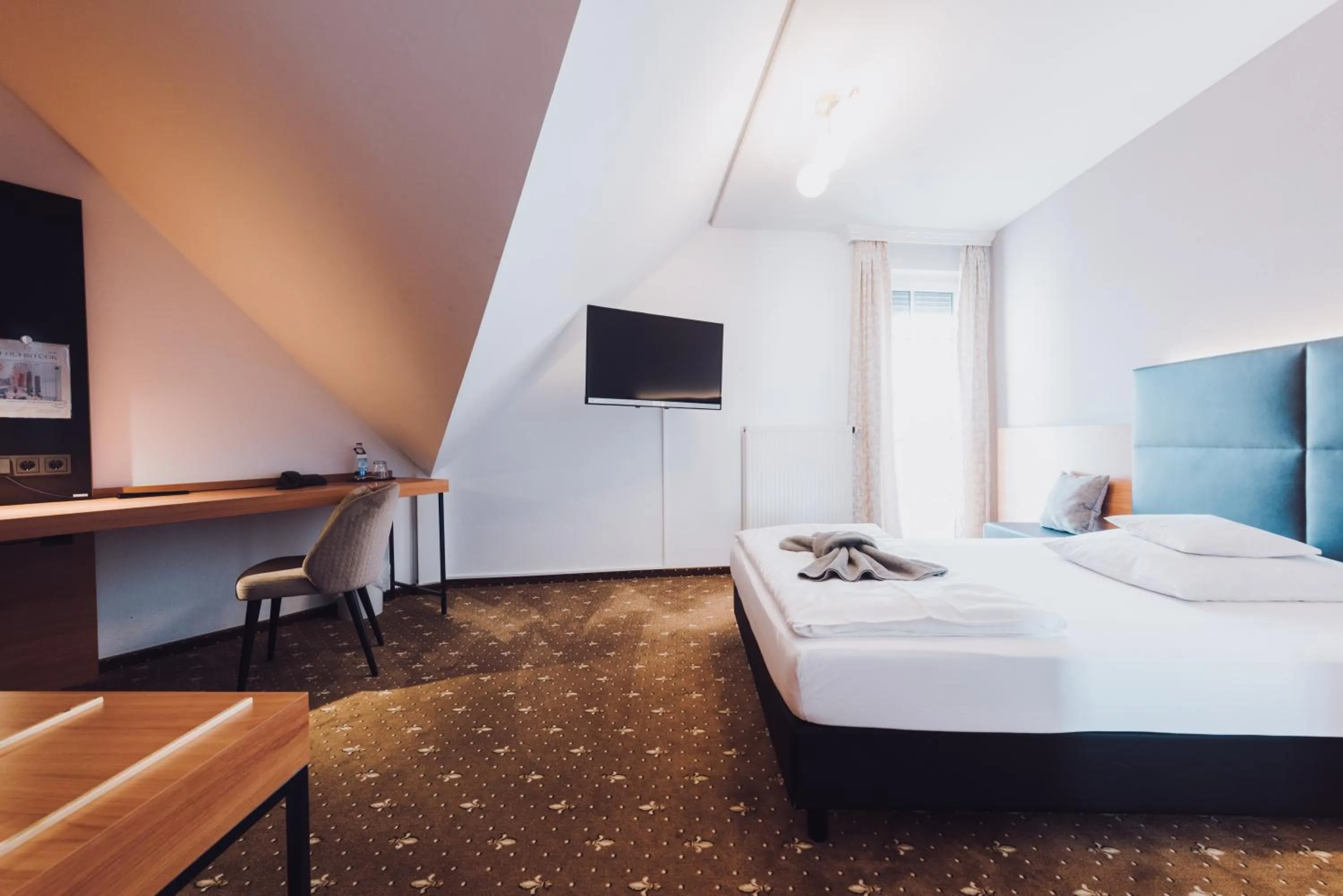 Photo of the whole room, Bed in Ambienthotel Tassilo