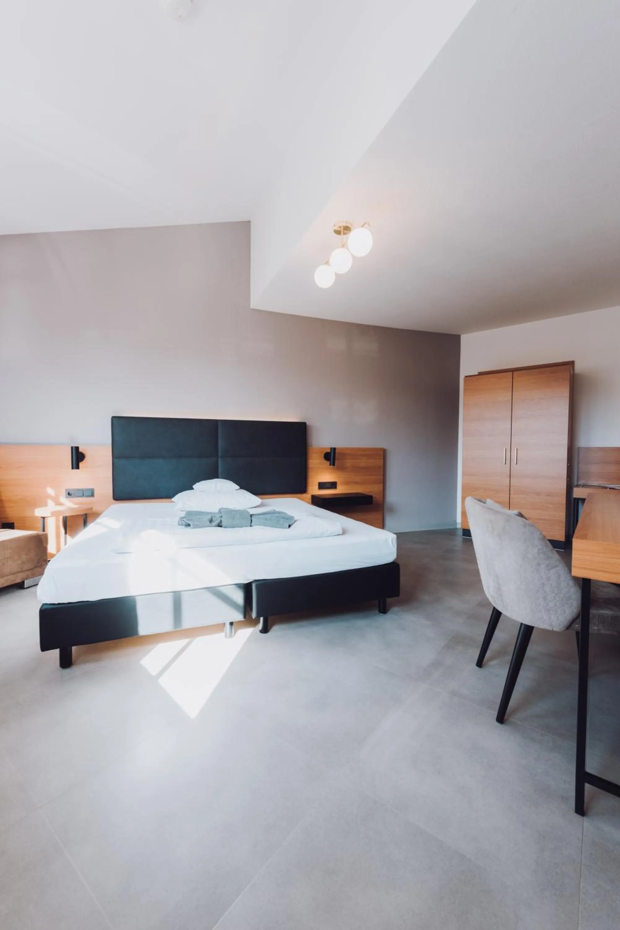 Bed in Ambienthotel Tassilo