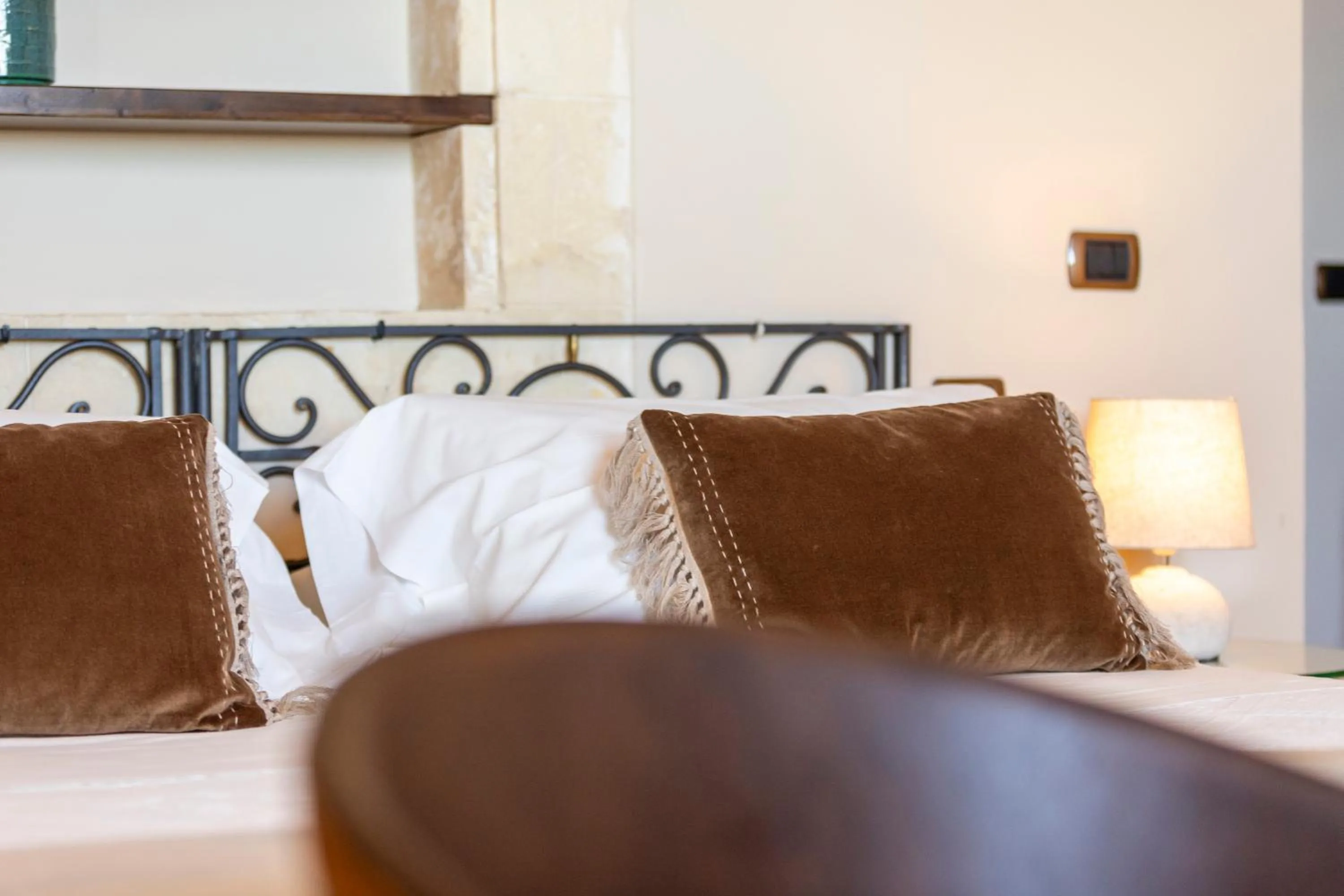 Decorative detail, Bed in Relais Torre Marabino