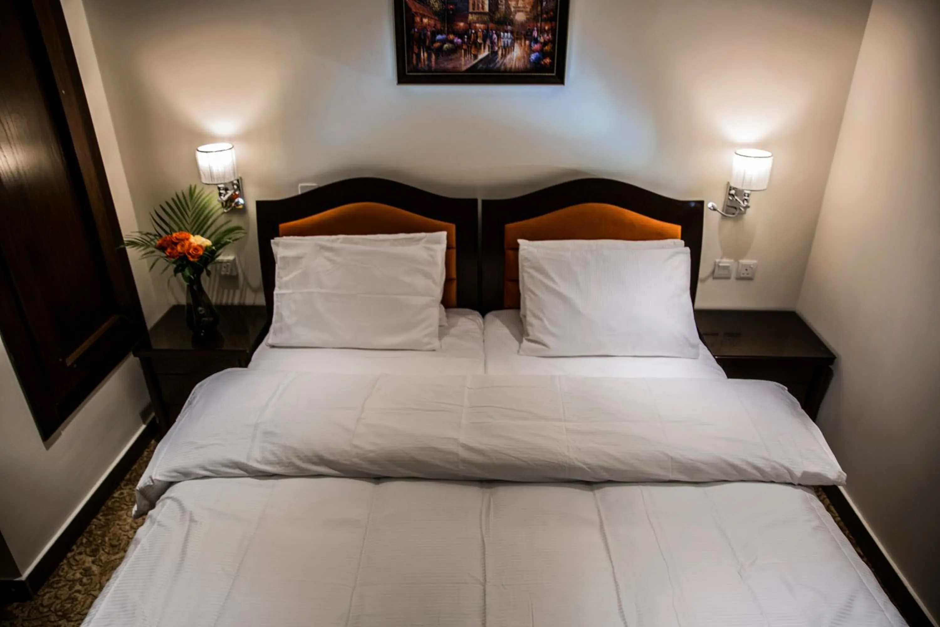 Bed in Naylover Hotel Suites