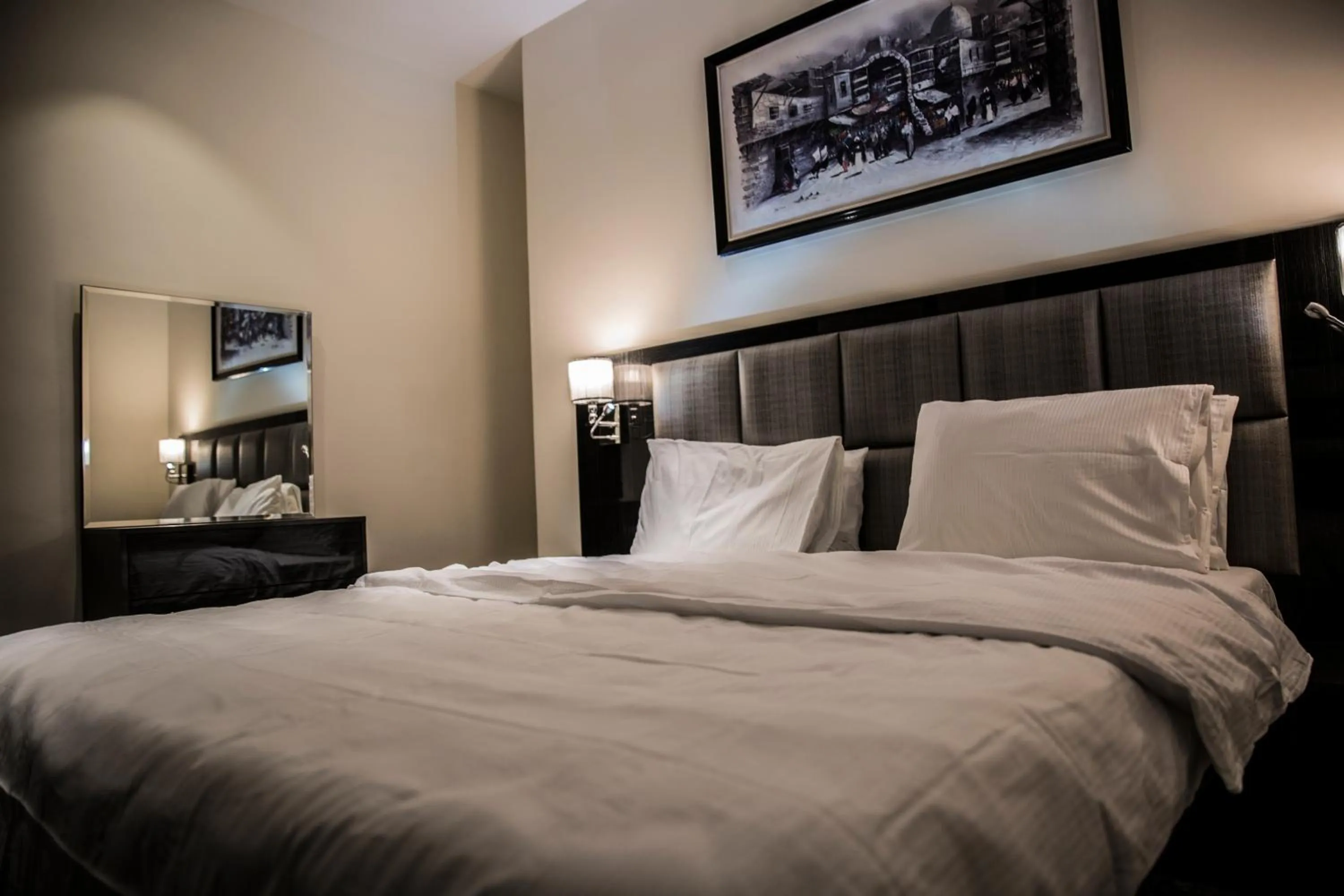 Bed in Naylover Hotel Suites