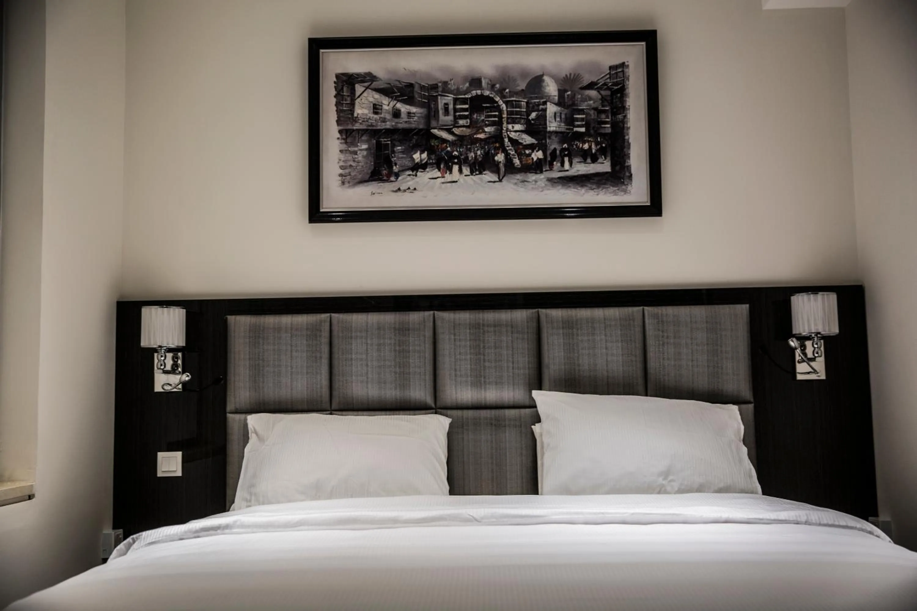 Bed in Naylover Hotel Suites