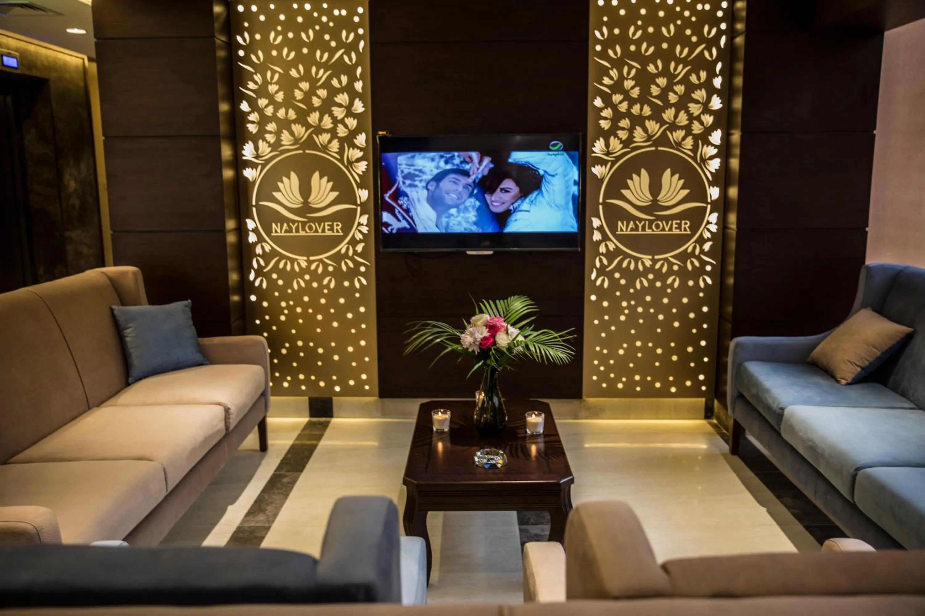 Property logo or sign in Naylover Hotel Suites