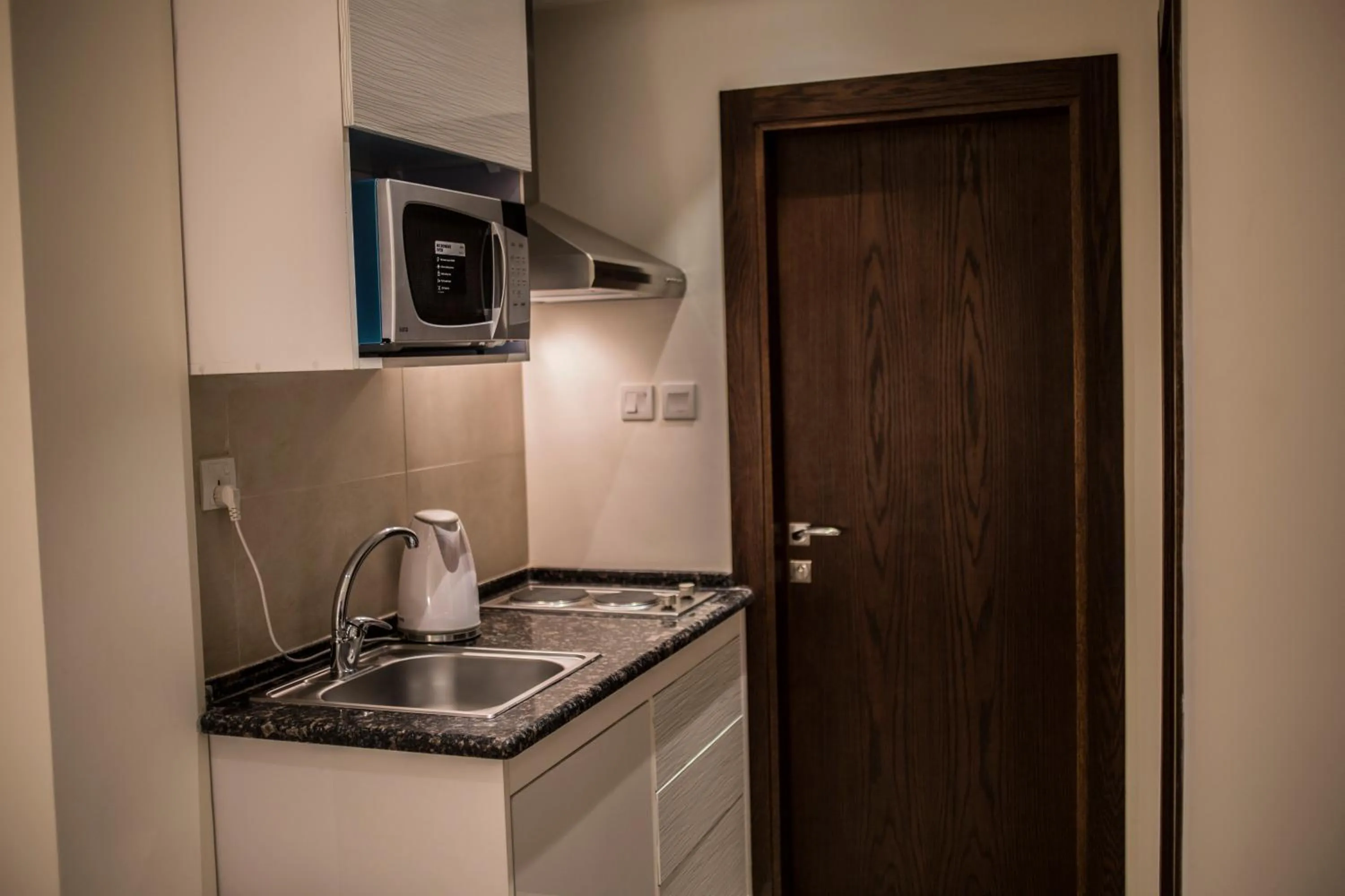 Kitchen or kitchenette in Naylover Hotel Suites