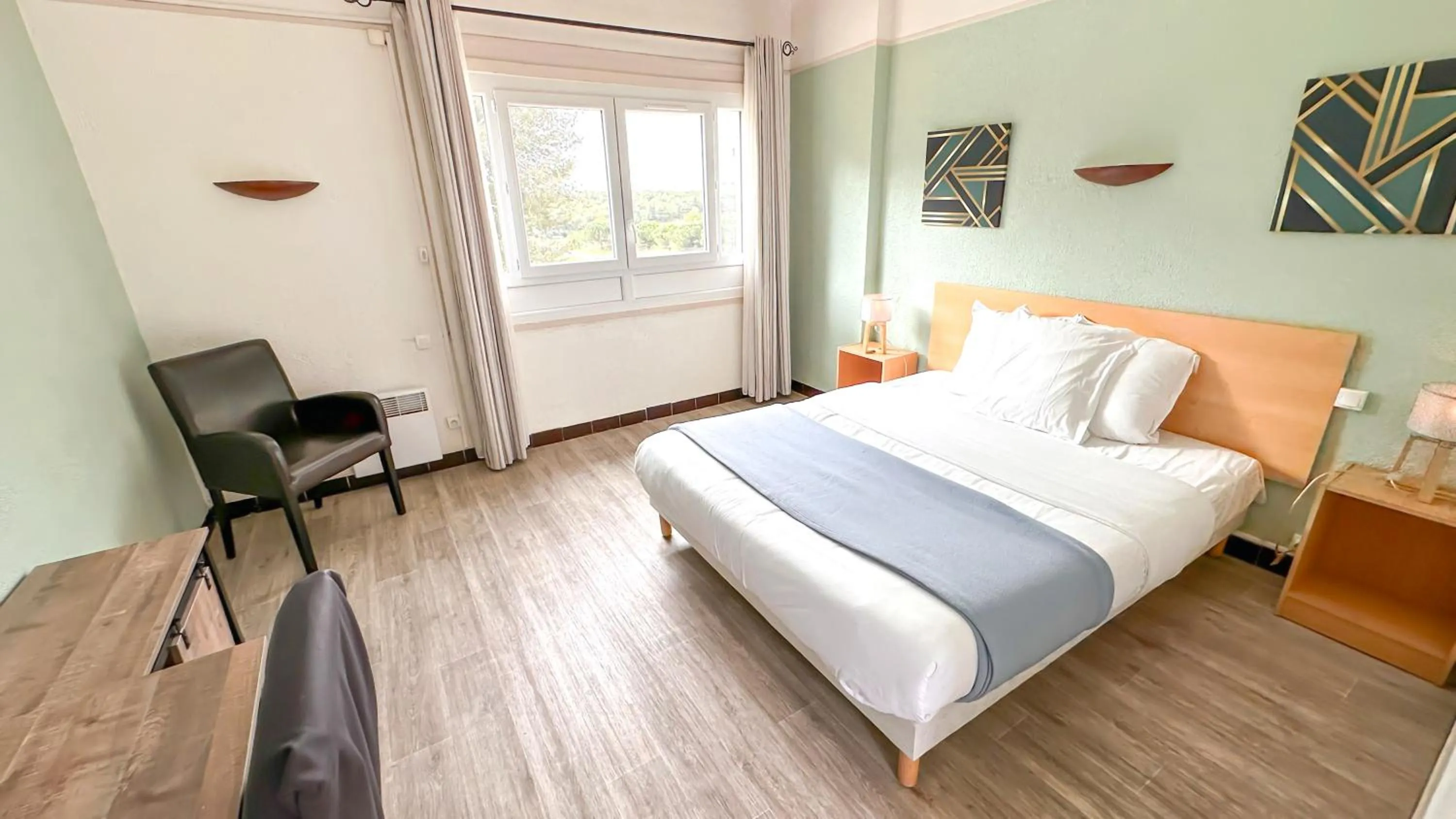 Bed in Hotel Les Rocailles