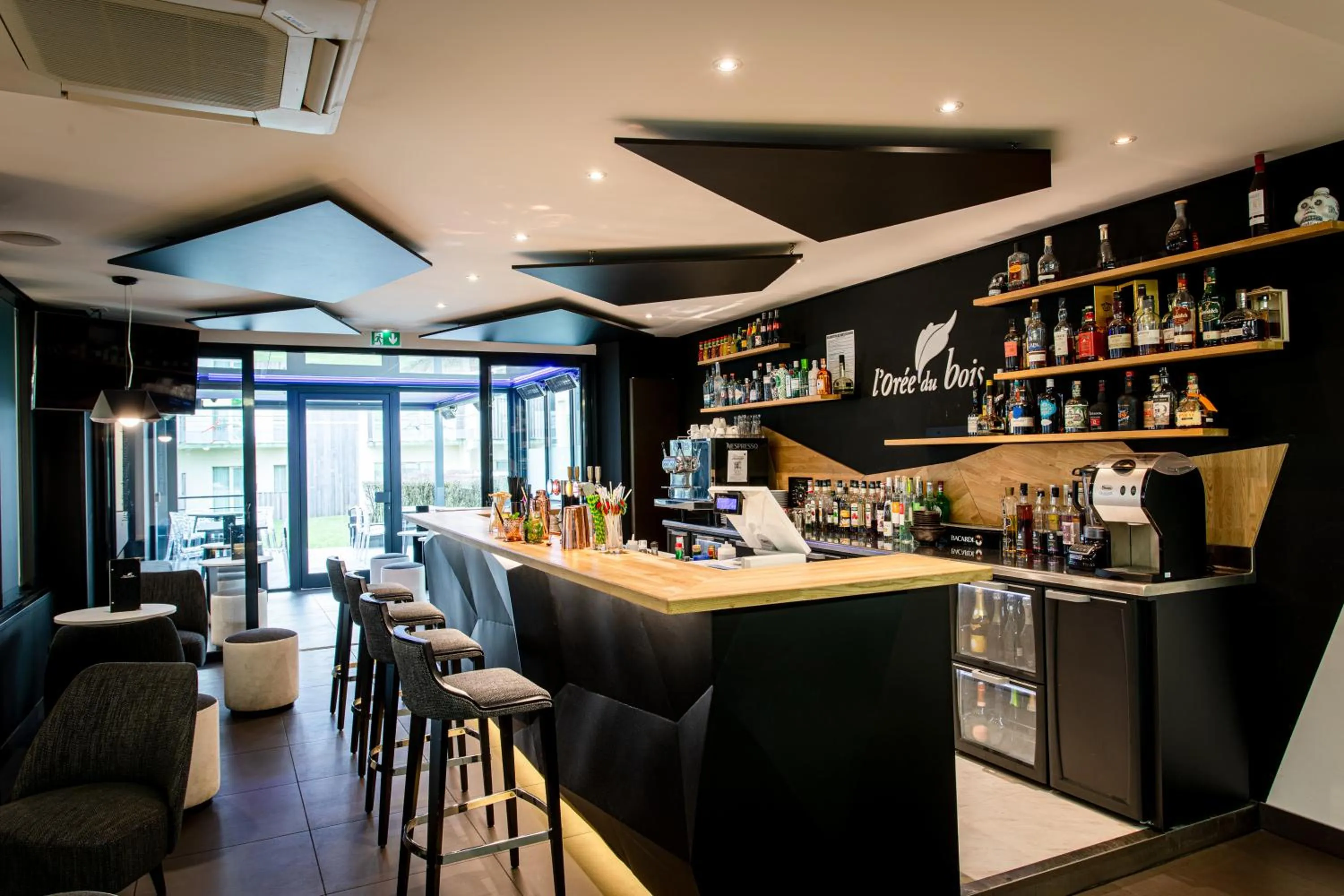 Lounge or bar in L'Orée du Bois