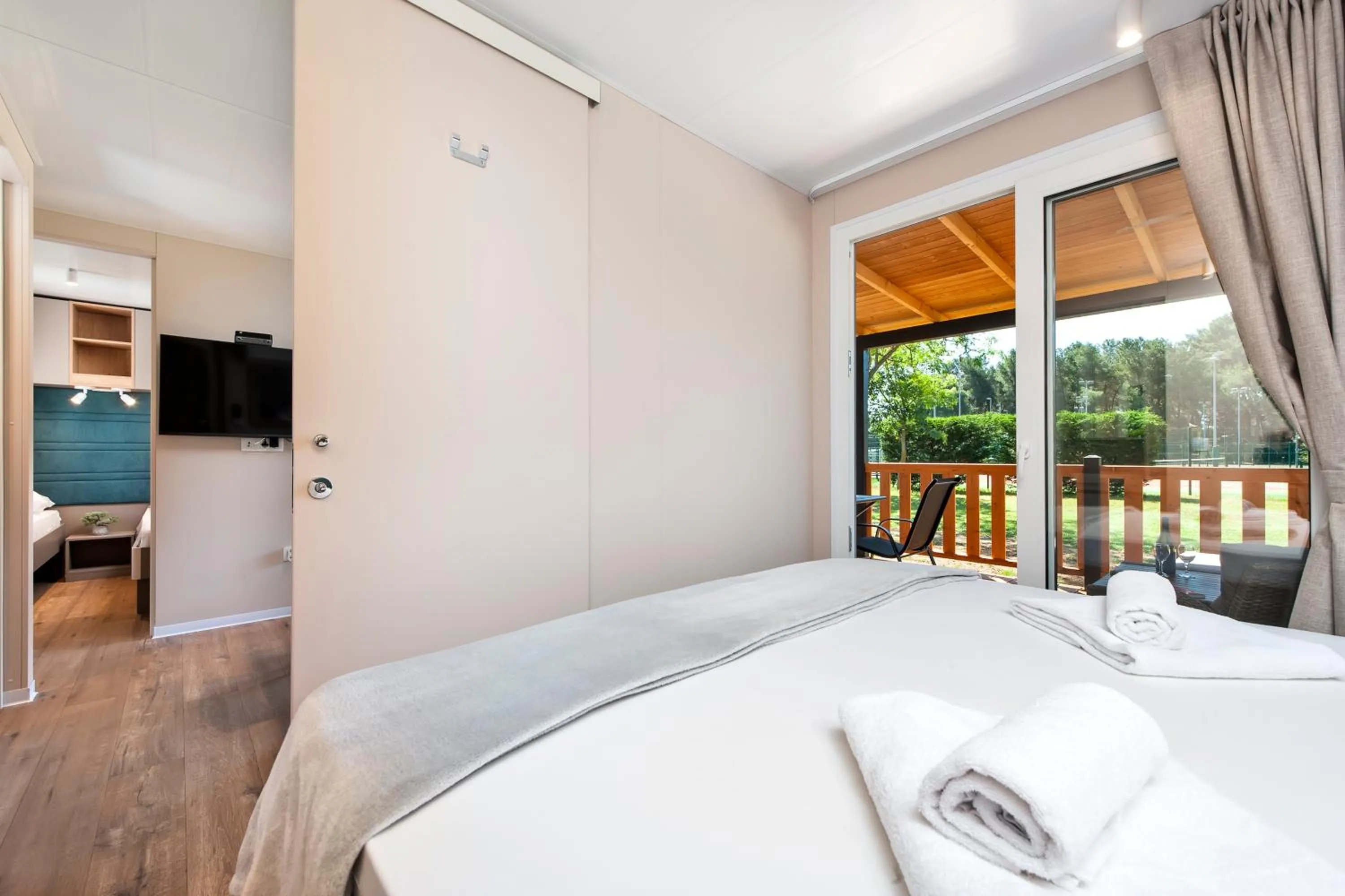 Communal lounge/ TV room, Bed in Glamping and Mobile Homes Lavanda - Holiday Centre Bi VIllage