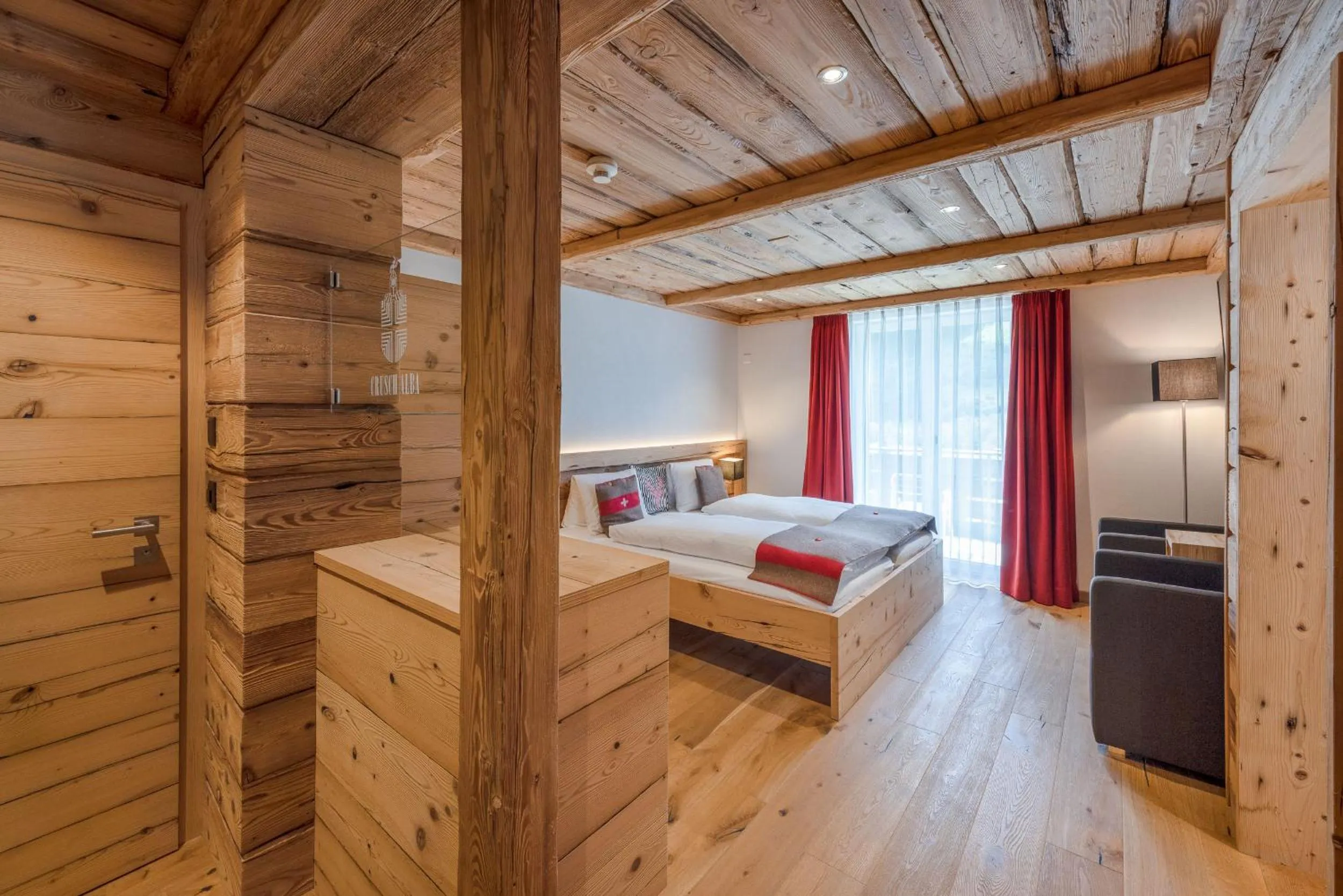 Photo of the whole room, Bed in Hotel Crusch Alba Zernez