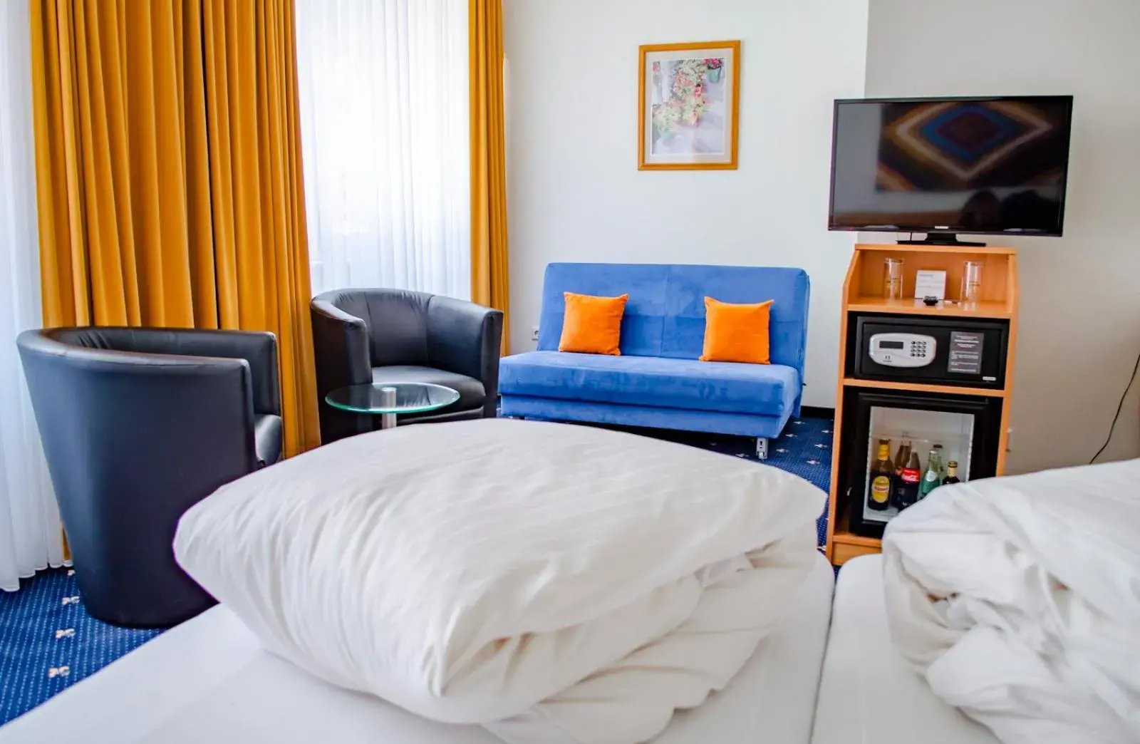 Family Room (Street side / no balcony) in Hotel Capri Family Room (Street side / no balcony) in Hotel Capri