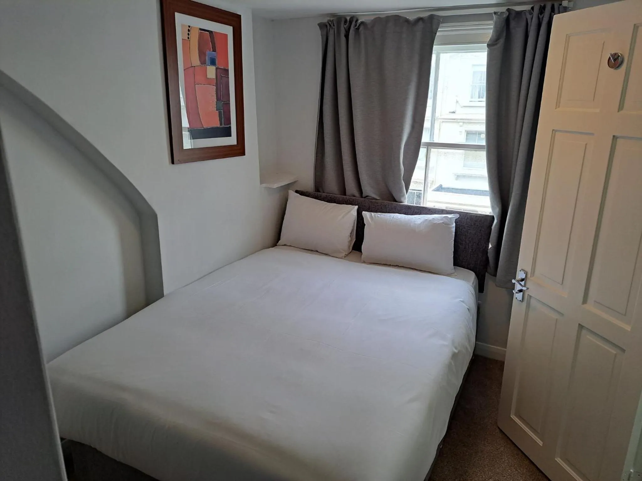 Bed in Palace Court Hotel