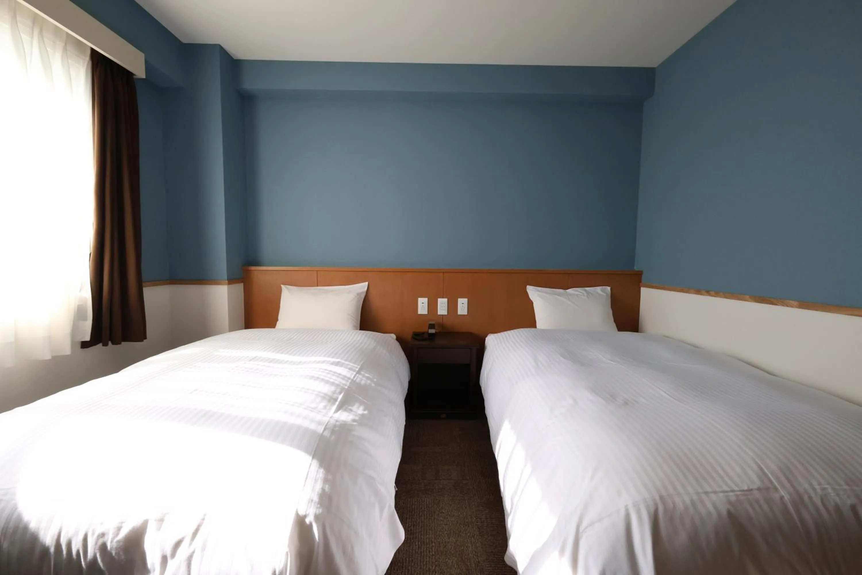 Bed in Kojohama Onsen Hotel